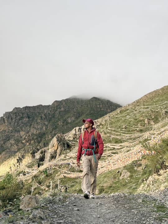 Walking a bare ridge path under cloud, Nepal.