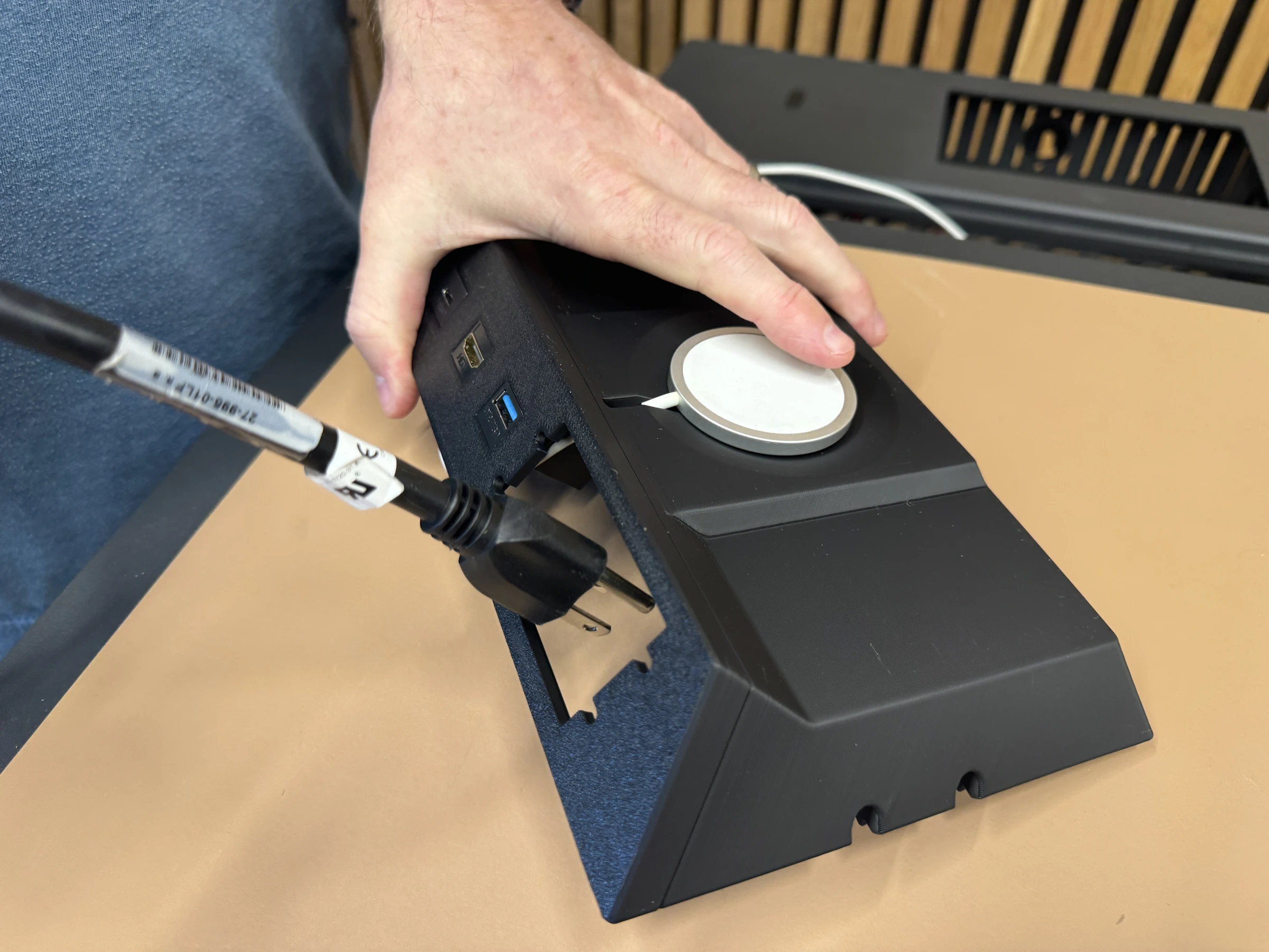 Photograph 21. Routing the power plug through the AAP opening.