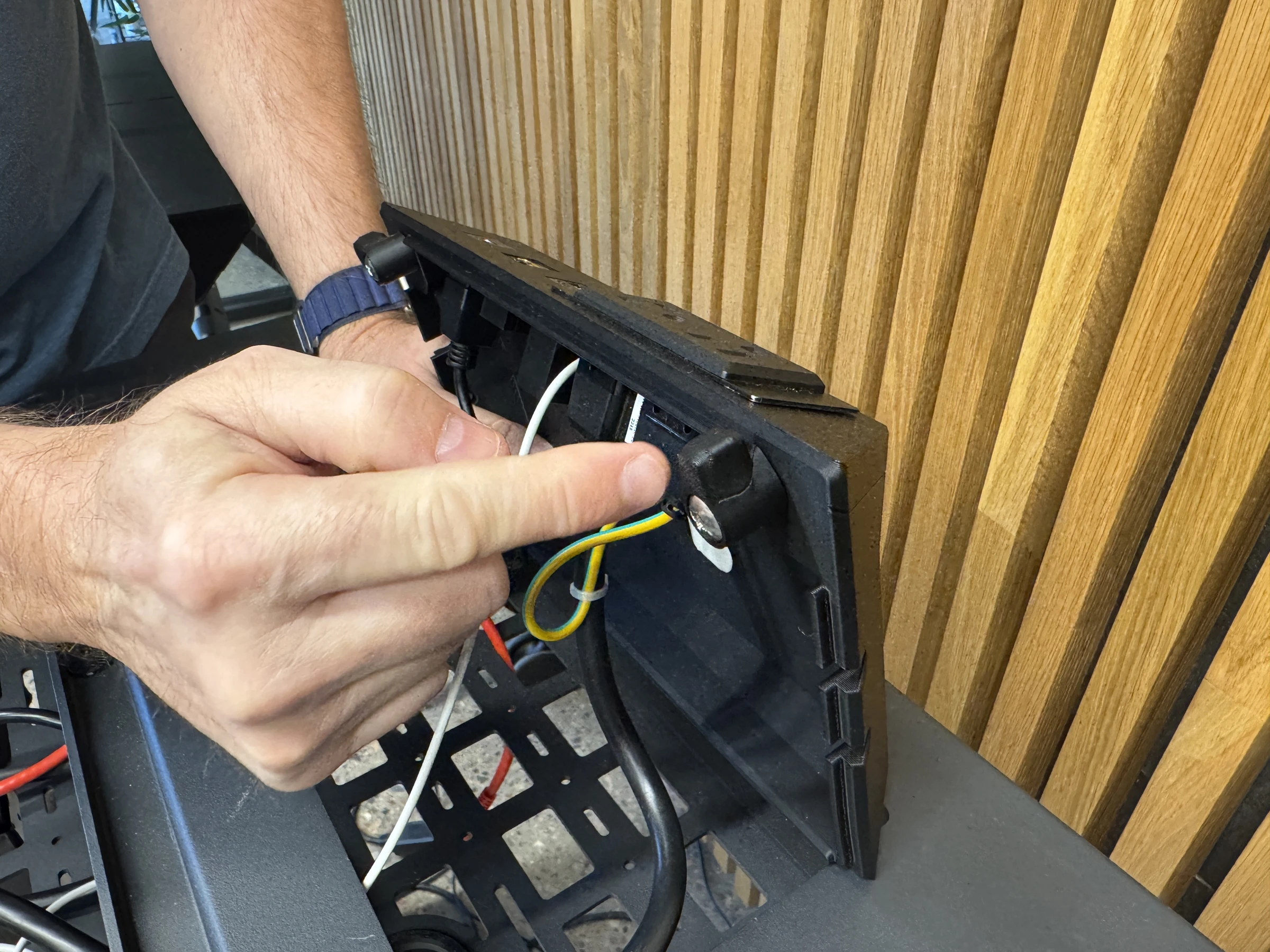 Photograph 28. Rotating a retaining tab beneath the insert.