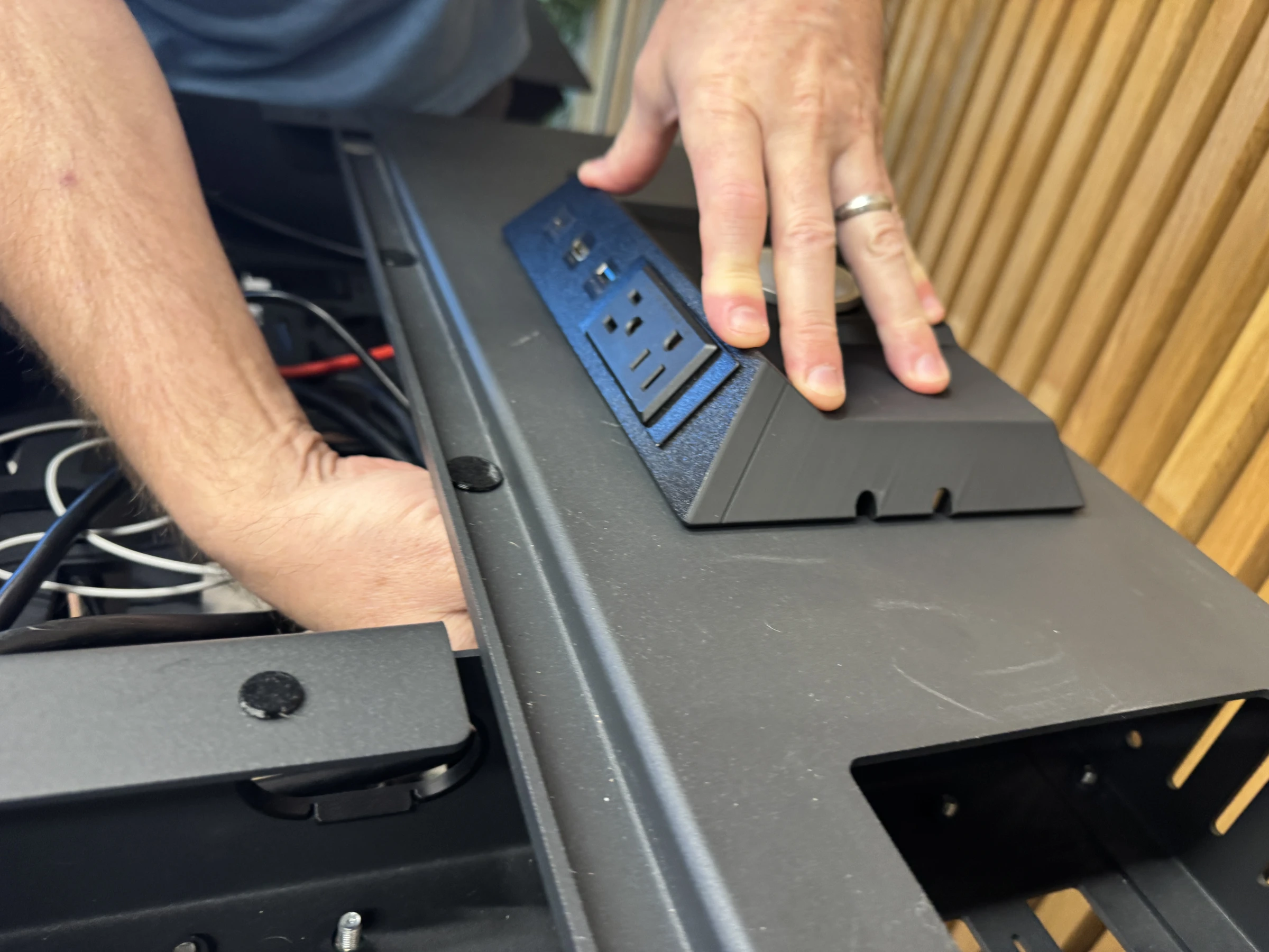 Photograph 33. Holding the insert flush while working beneath the desktop.