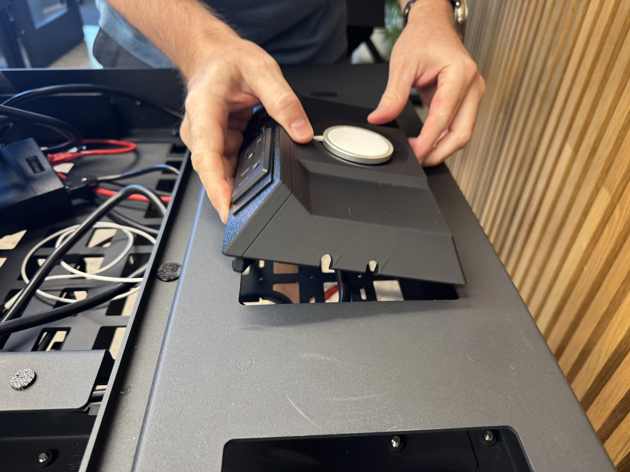 Photograph 30. Lowering the populated insert into the lectern opening.