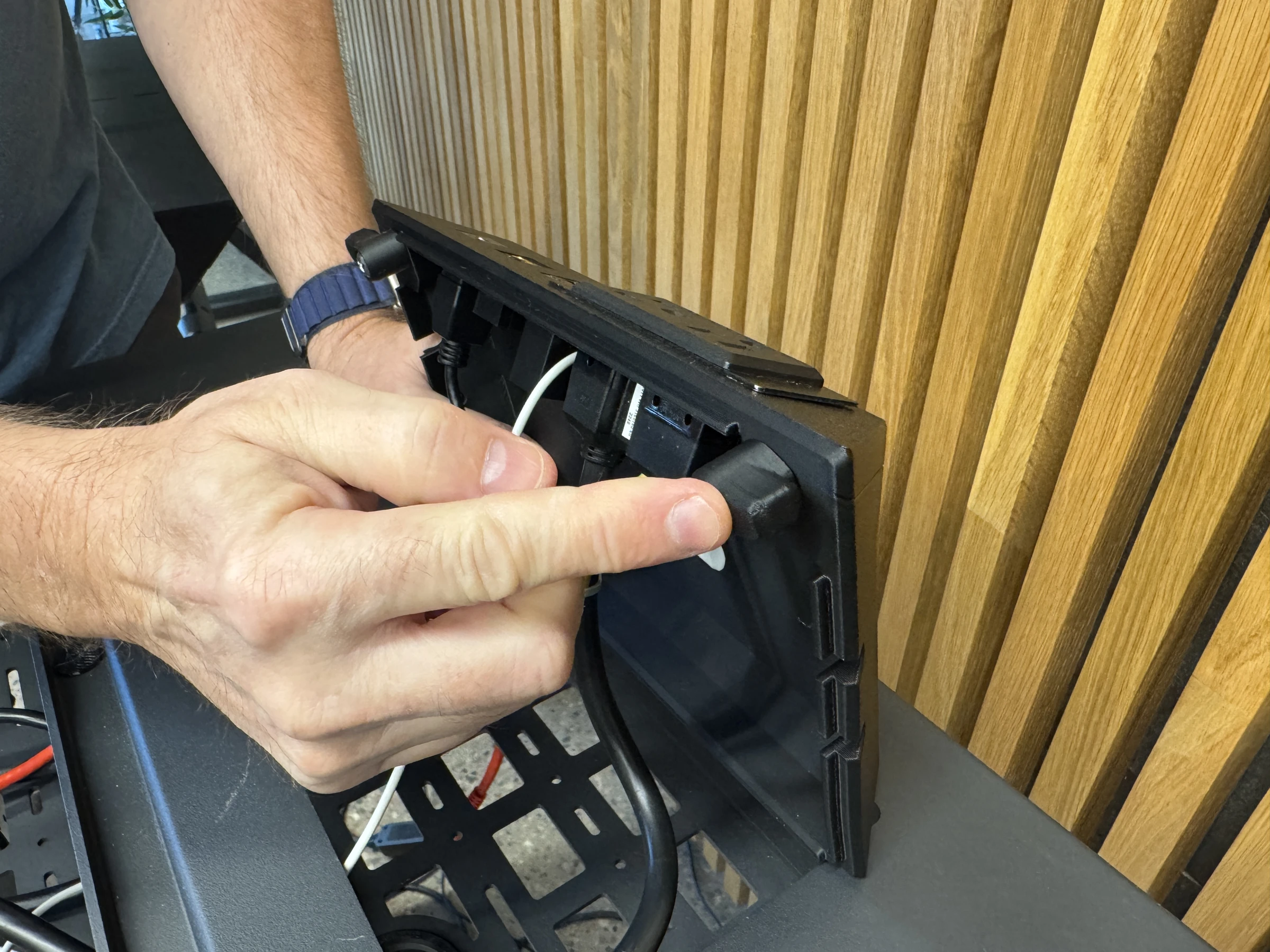 Photograph 29. Rotating a retaining tab beneath the insert.