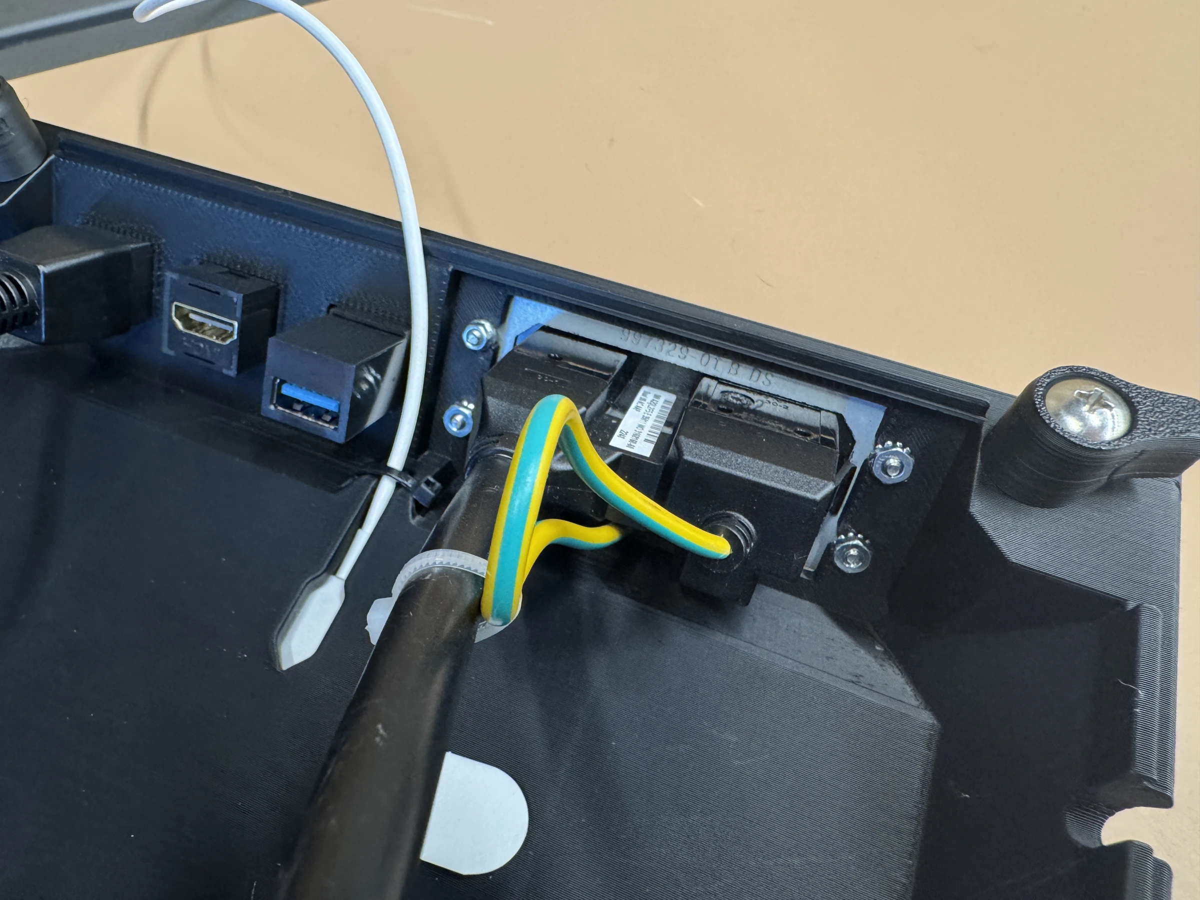 Photograph 25. Securing the power module with four mounting nuts.
