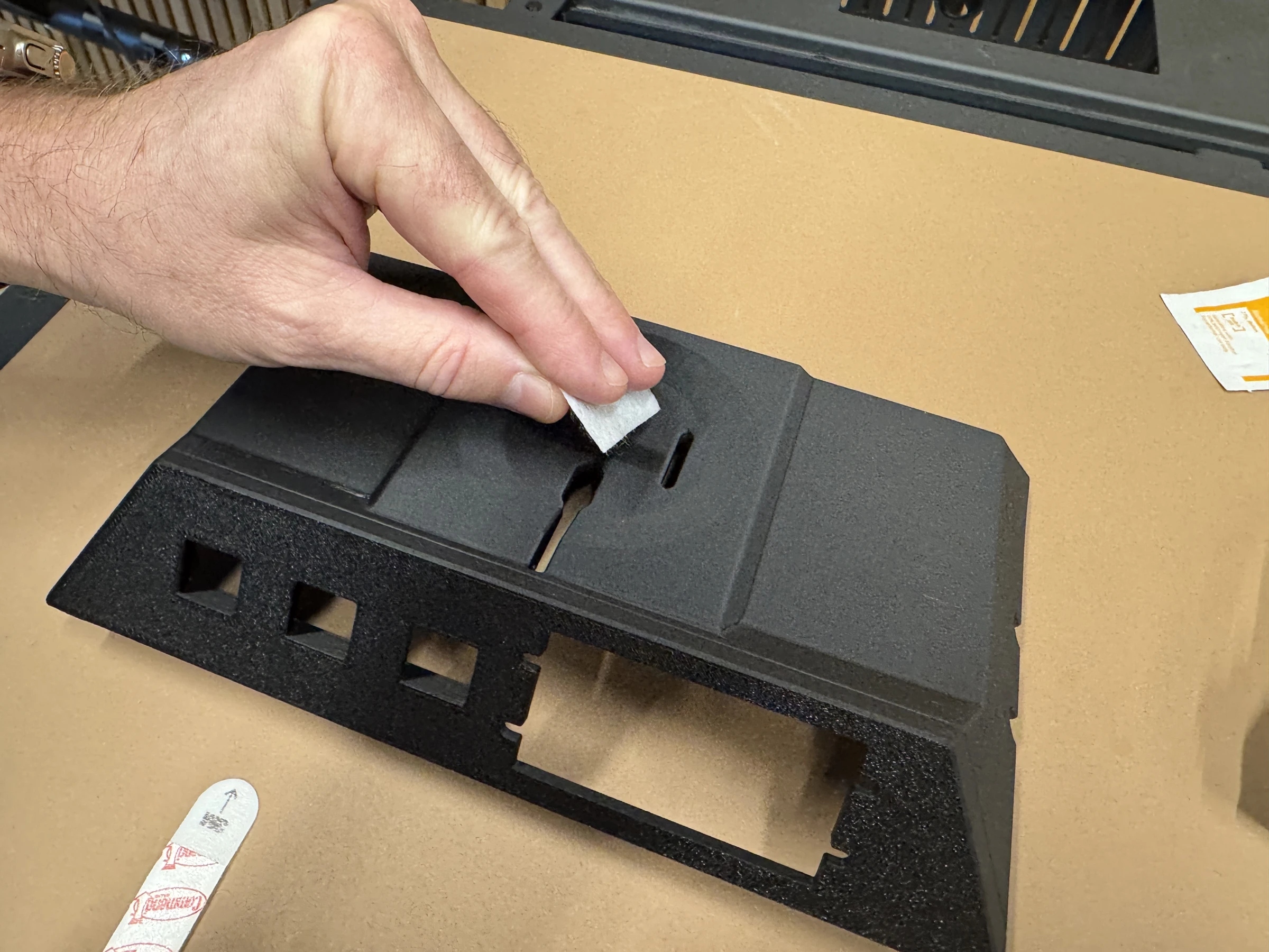 Photograph 2. Wiping the recessed mounting surface with an alcohol pad.