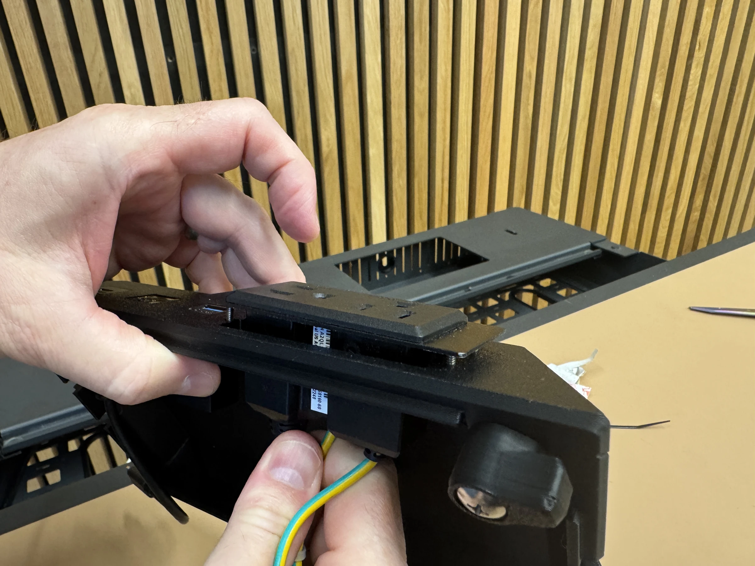 Photograph 22. Positioning the power module at its mounting opening.