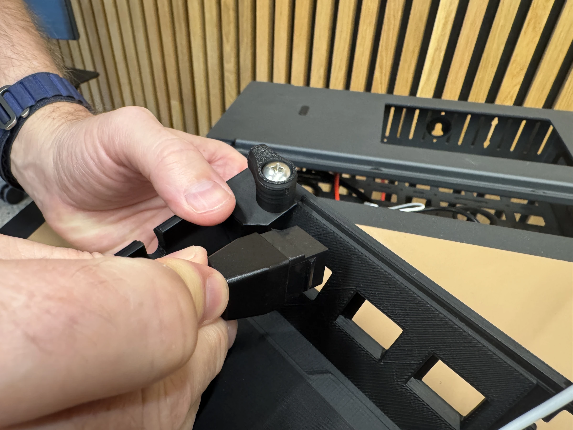 Photograph 17. Positioning a keystone module at an opening in the insert.