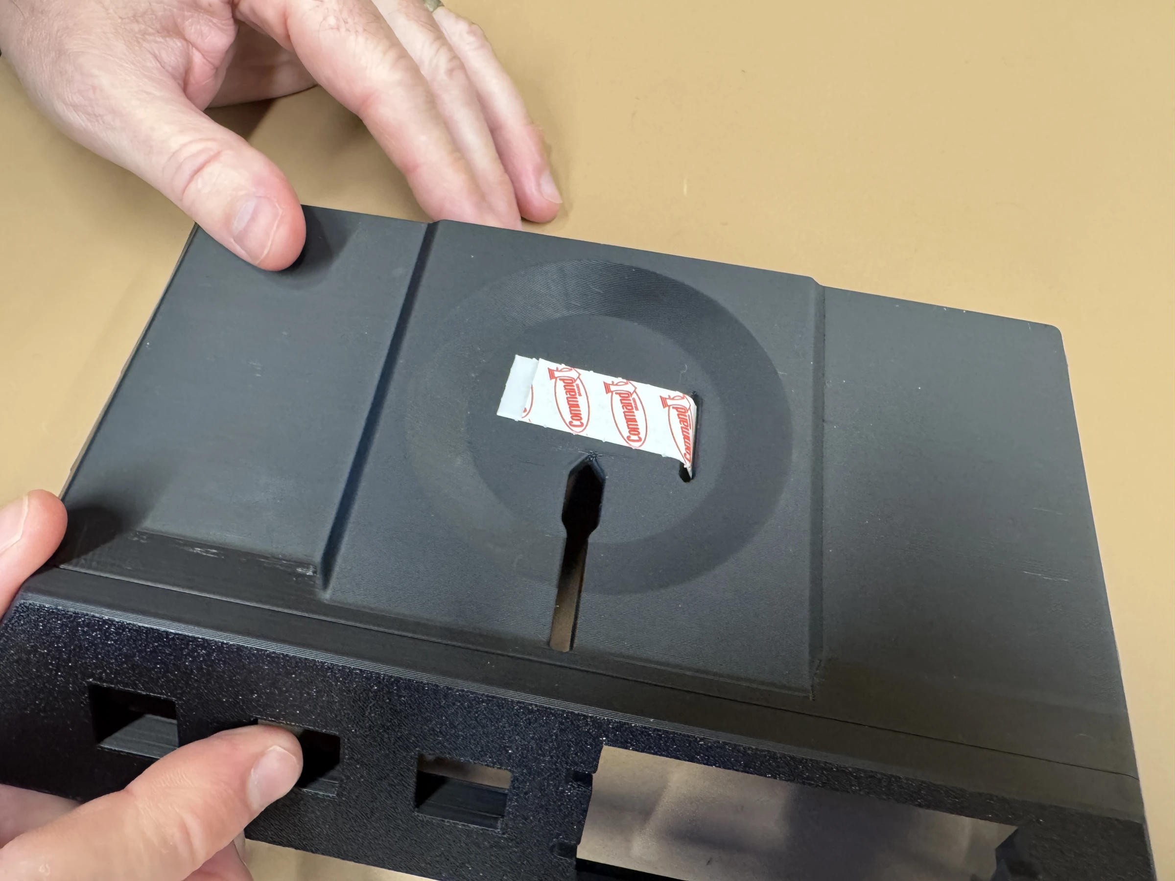 Photograph 6. A single adhesive strip positioned on the recessed mounting surface.