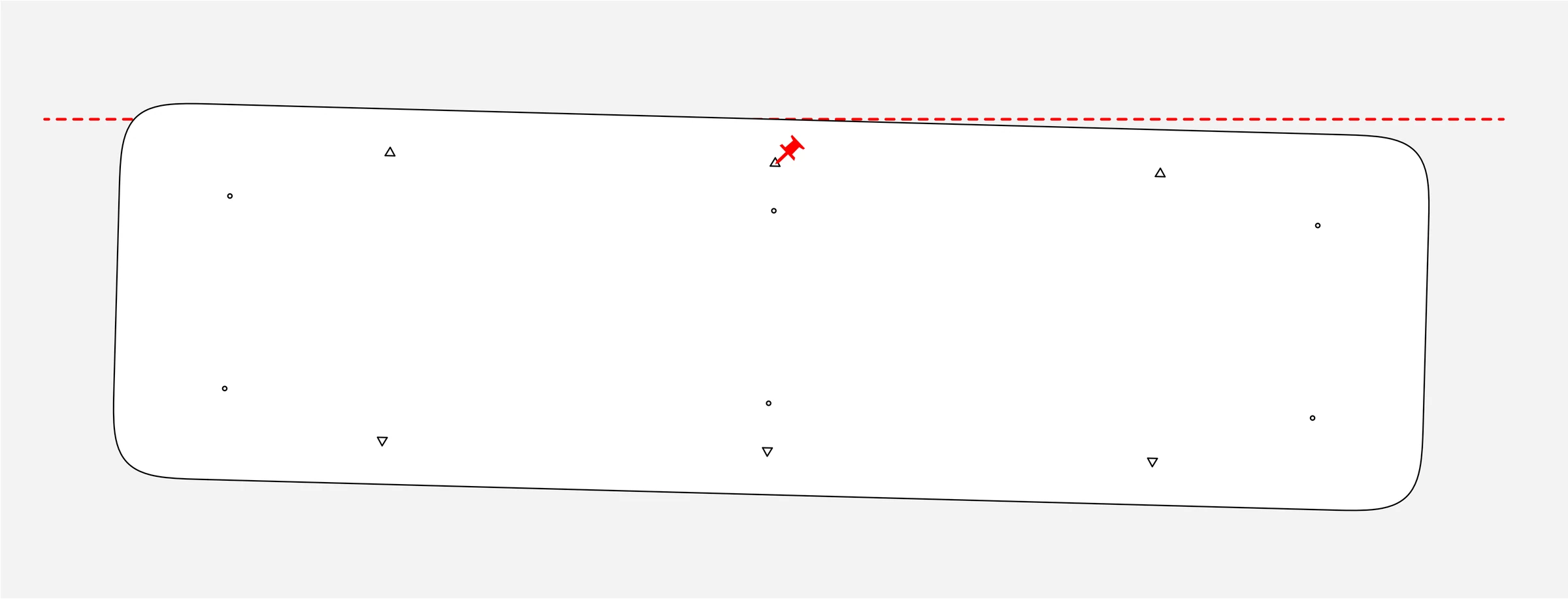 Installation template suspended from a push pin below a horizontal laser-level reference line.