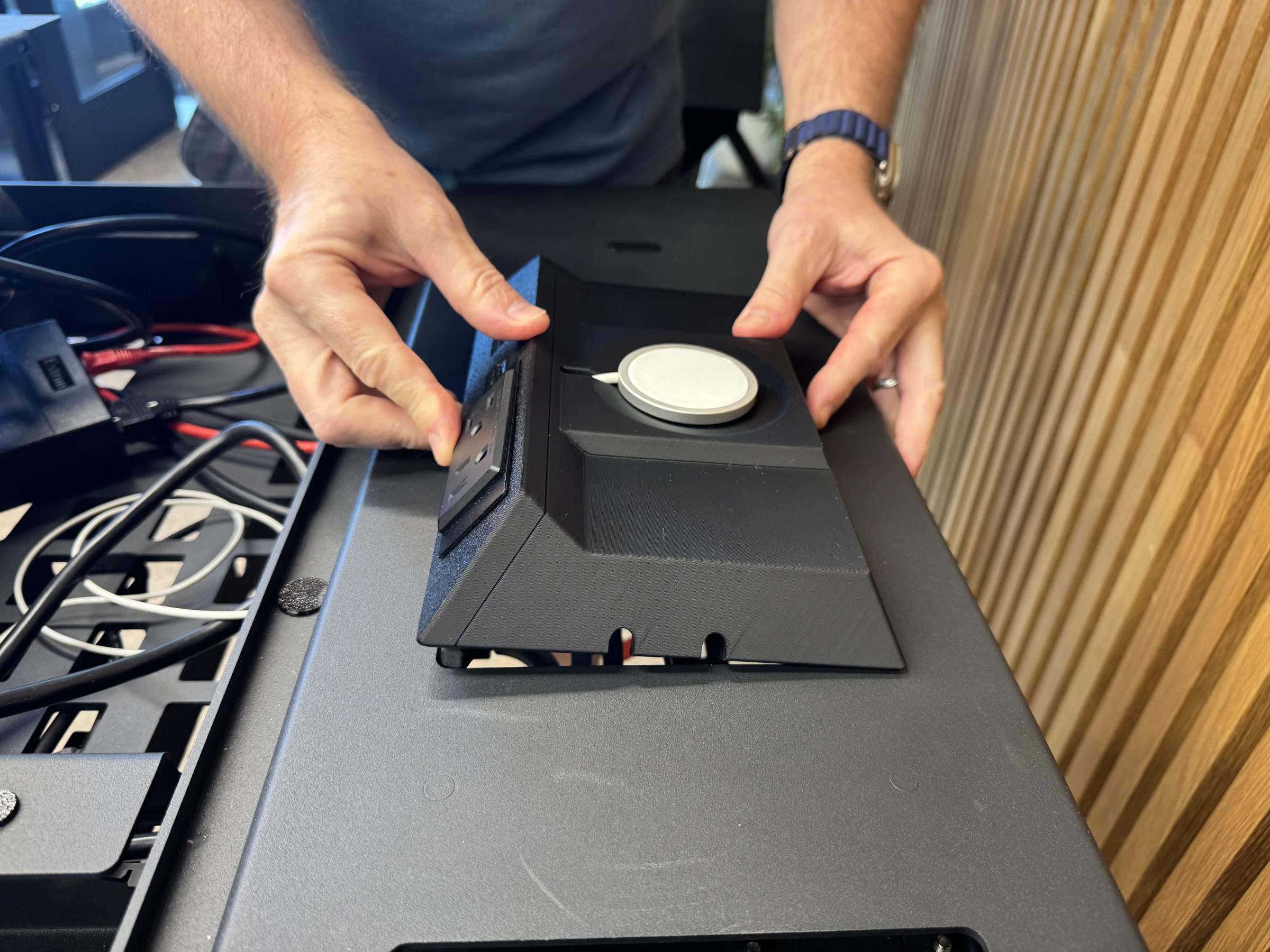 Photograph 32. Holding the insert at both sides as it is positioned in the lectern opening.