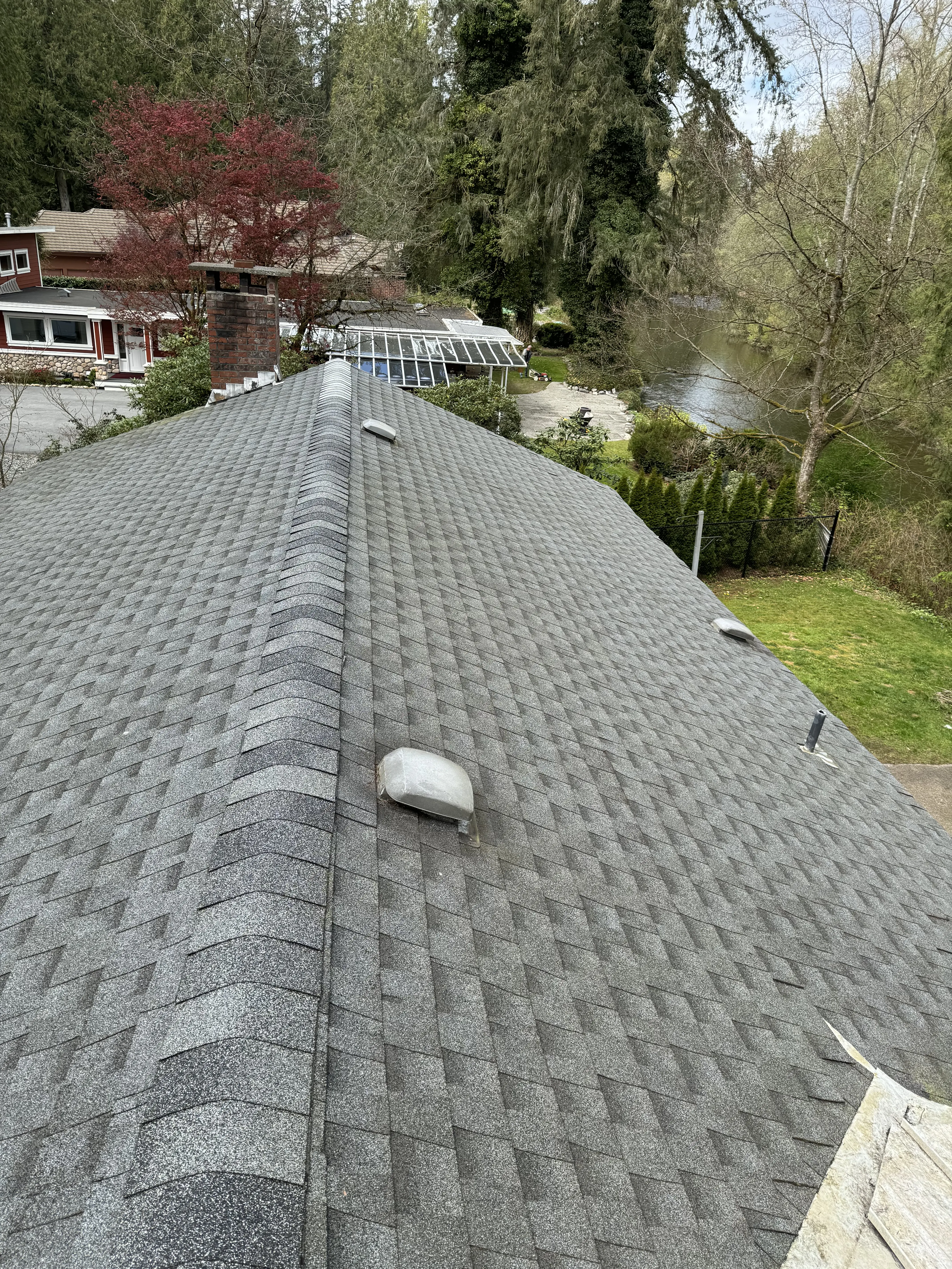 After - Roof cleaning transformation showing removal of moss, algae, and debris for improved appearance and longevity