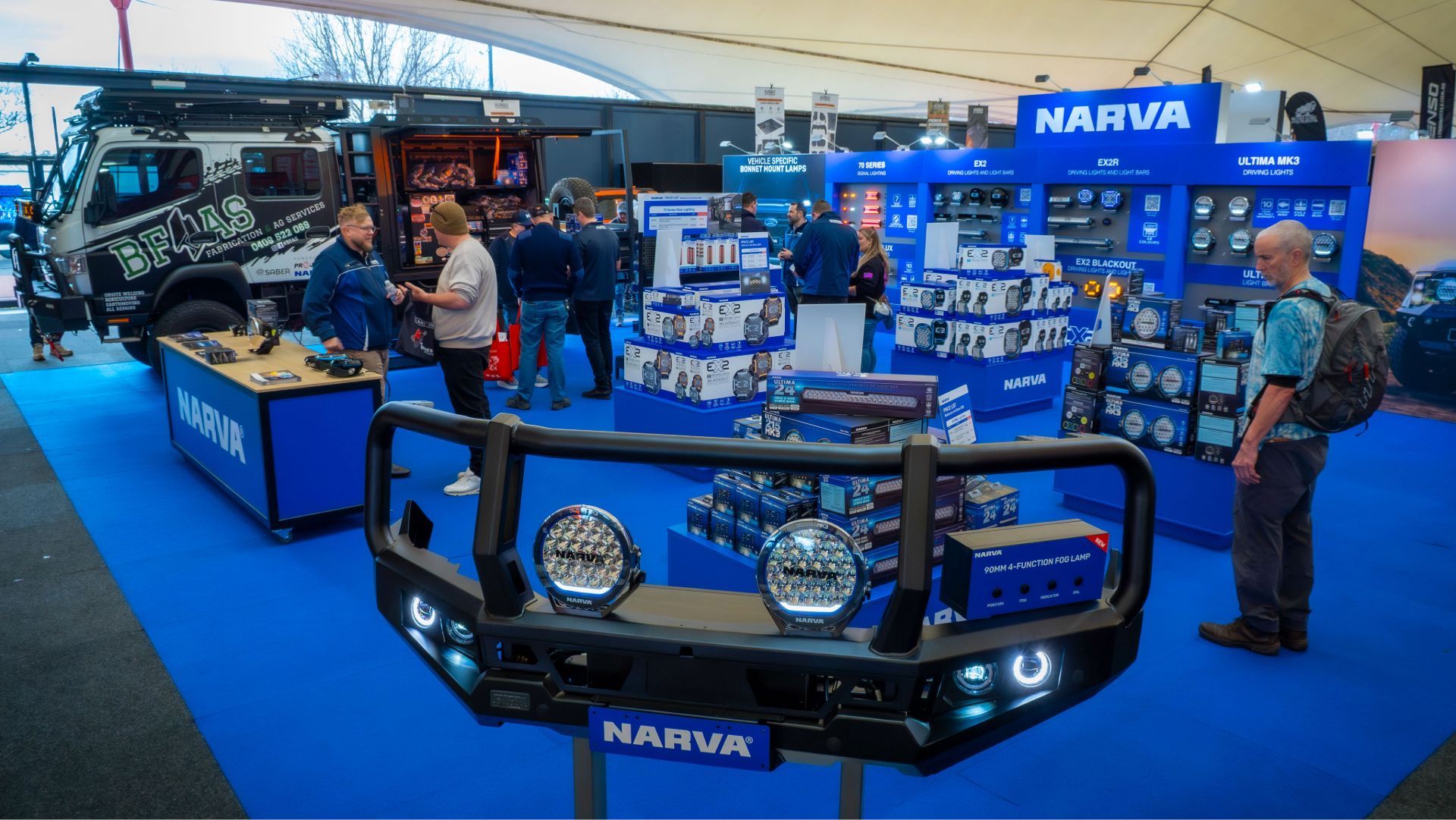 Visitors exploring NARVA automotive lighting and electrical solutions
