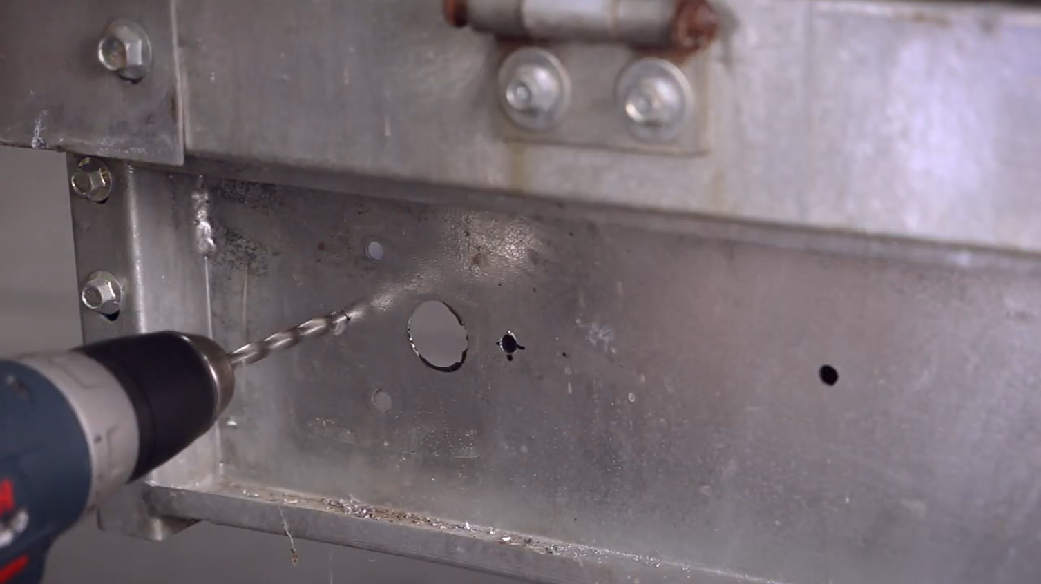 measure and drill new holes into trailer