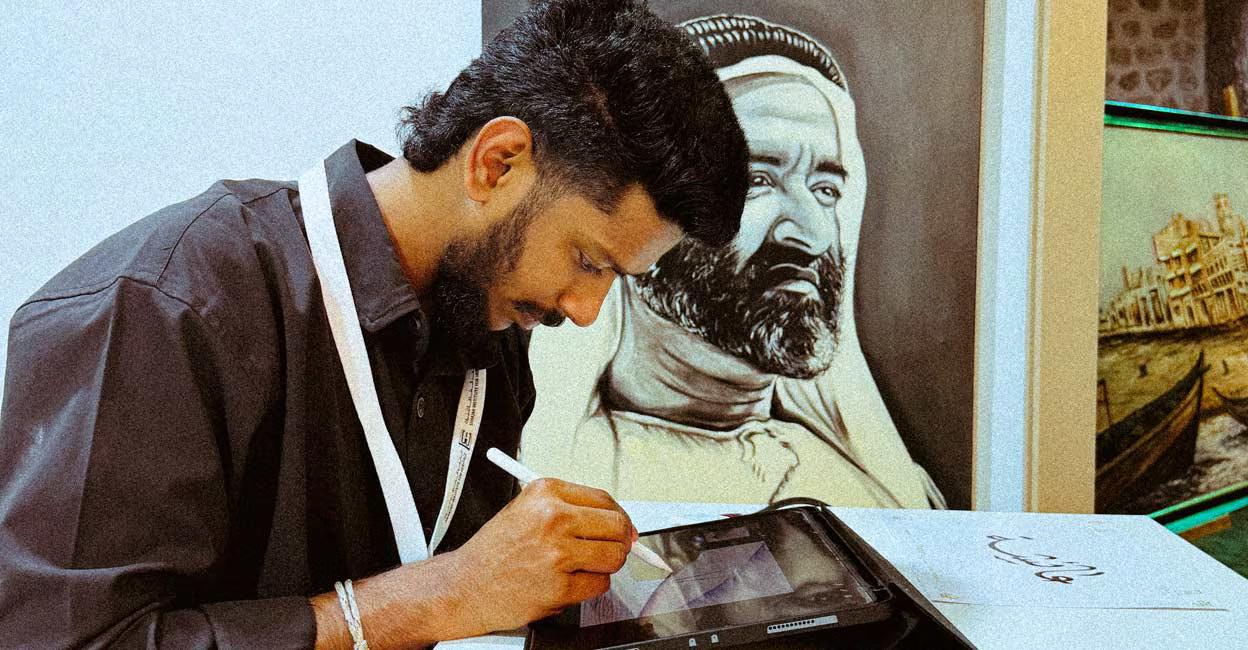 Muhammed Bilal sketches a design at his desk at the Sharjah Institute for Heritage.