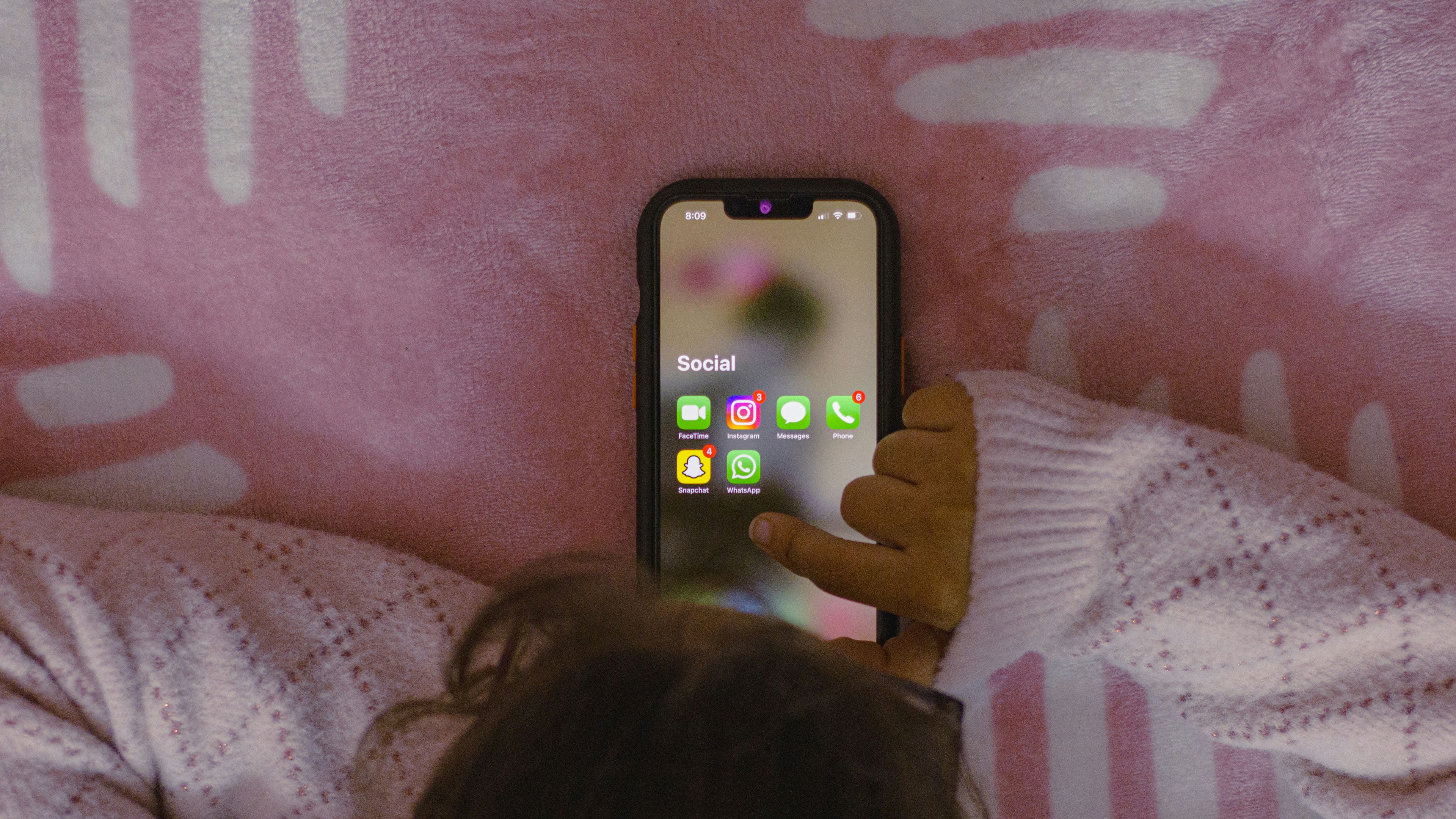 Representative image of kid holding mobile