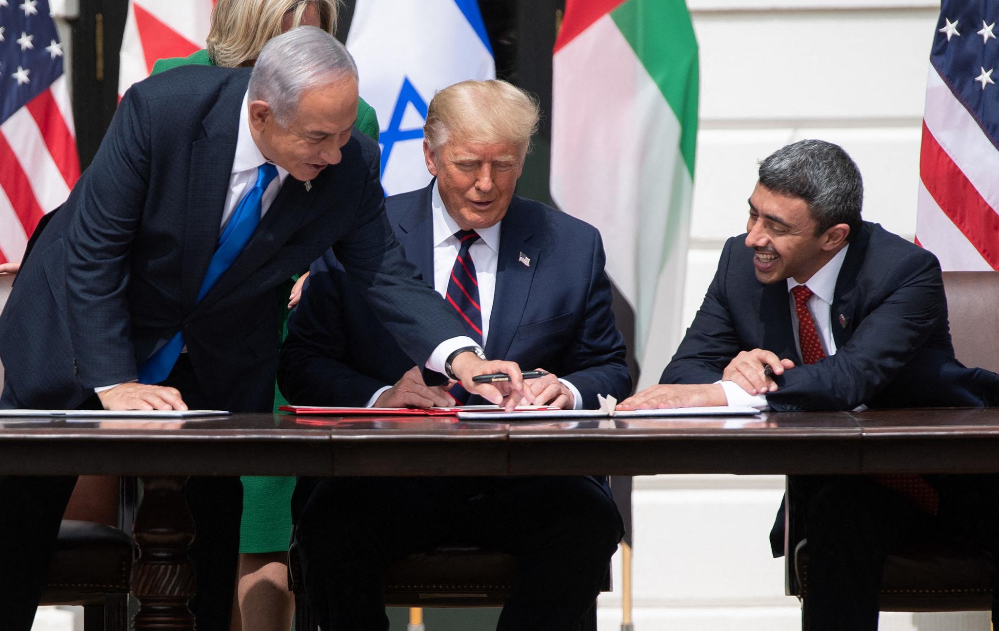 Israeli Prime Minister Benjamin Netanyahu (left) joins US President Donald Trump and UAE Foreign Minister Abdullah bin Zayed Al Nahyan (right) at the White House for the signing of the Abraham Accords, which normalised diplomatic relations between Israel and the UAE, September 15, 2020. Photo: Tia Dufour/White House Gallery 