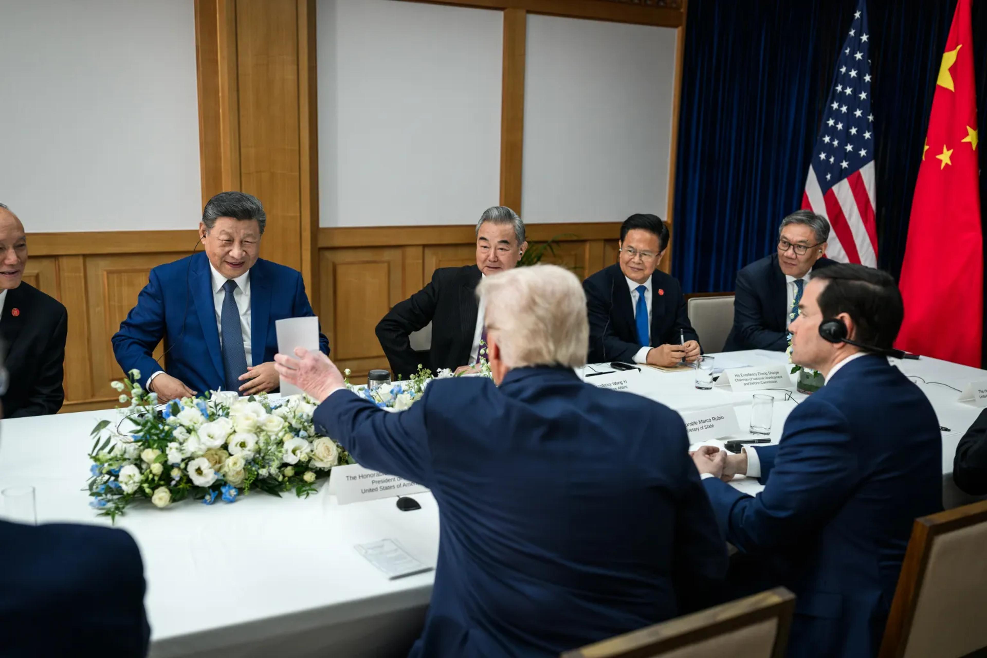 Xi Xinping and Donald Trump in an animated discussion during a meeting at the recent Beijing summit.