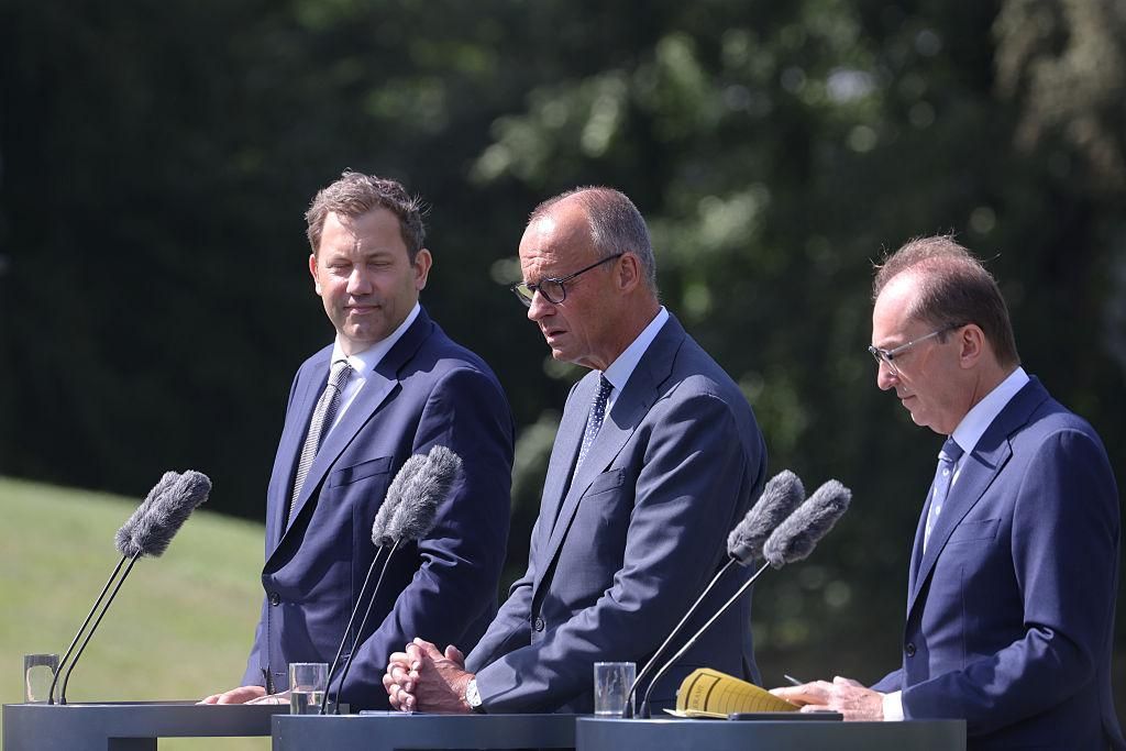 German Chancellor Friedrich Merz, Finance Minister Lars Klingbeil and Interior Minister Alexander Dobrindt at a press conference following the cabinet retreat at Schloss Neuhardenberg, August 26, 2026. Photo: Bundesregierung/Steffen Kugler