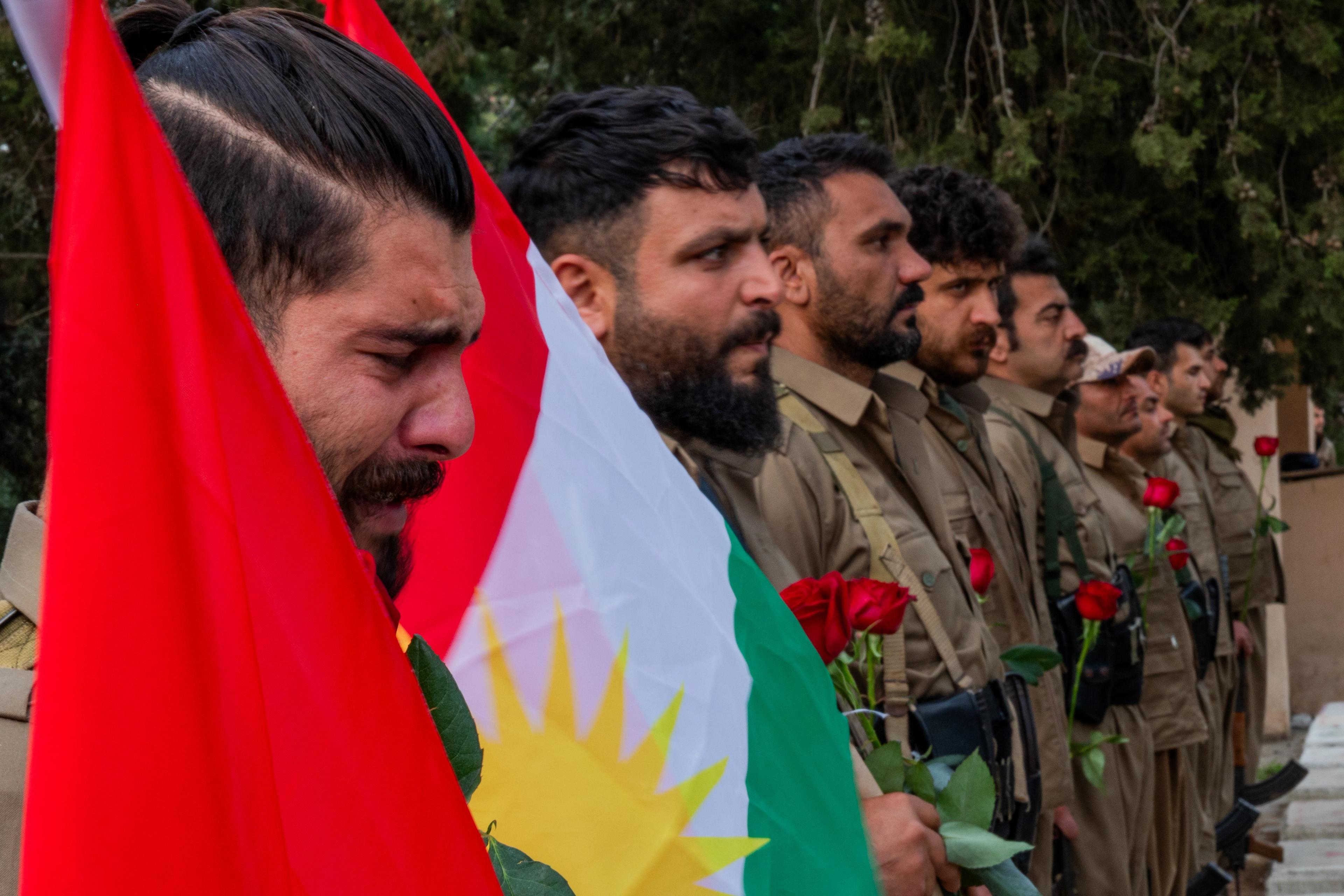 A Komala commander grieves at the funeral of Ghazal Molan. 
