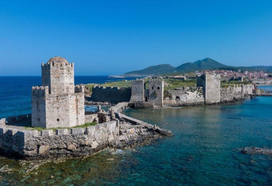 Methoni Castle and its iconic Bourtzi sea fort, seen on a rocky islet off the coast of Messenia in southwestern Greece. The medieval fortress is one of the Mediterranean’s most important fortified complexes and was strategically positioned along major sea routes.