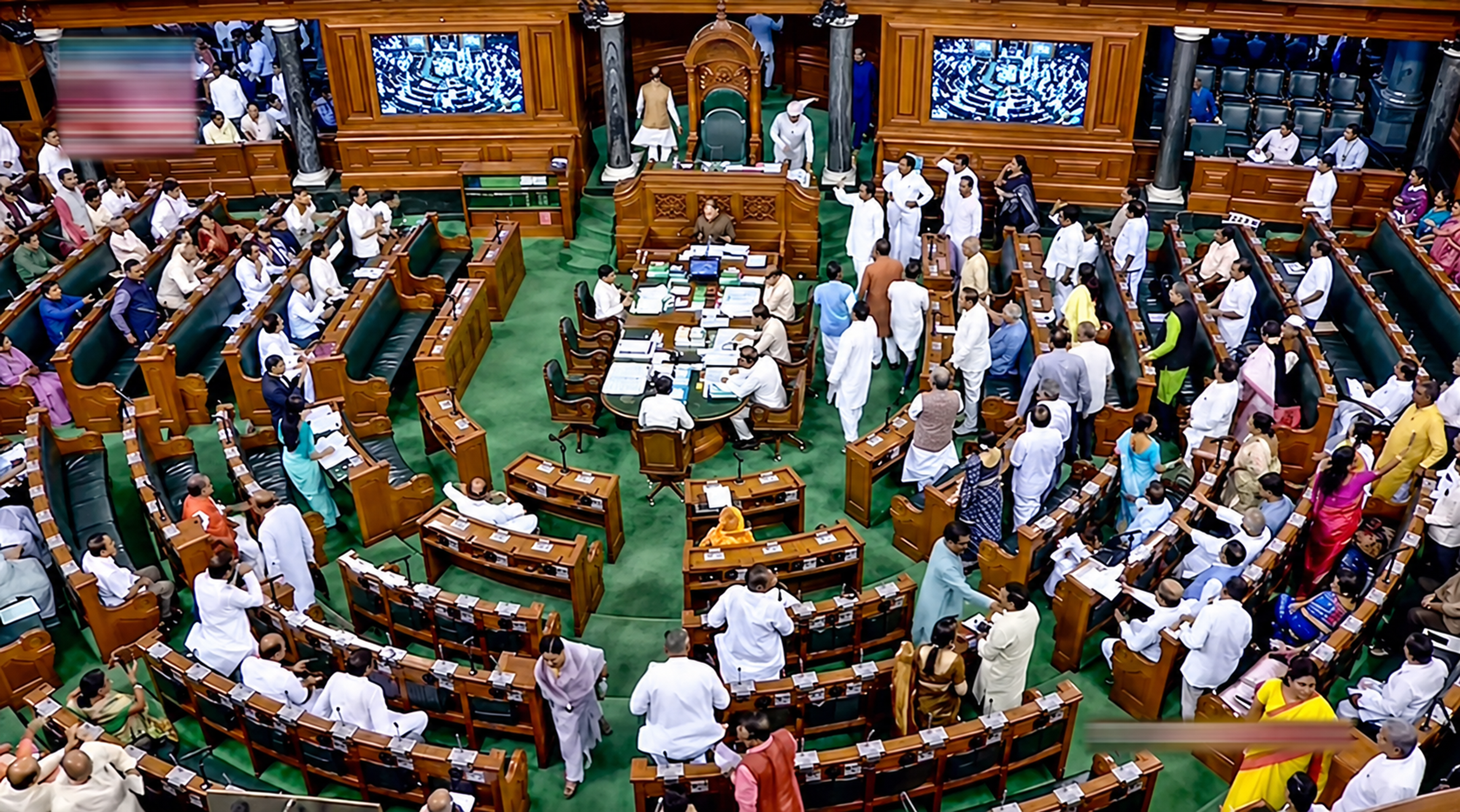 Opposition MPs protest in the Lok Sabha as Speaker Om Birla leaves the chamber amid sloganeering during proceedings at the old Parliament House in New Delhi on March 27, 2023. Credit: PIB/Government of India