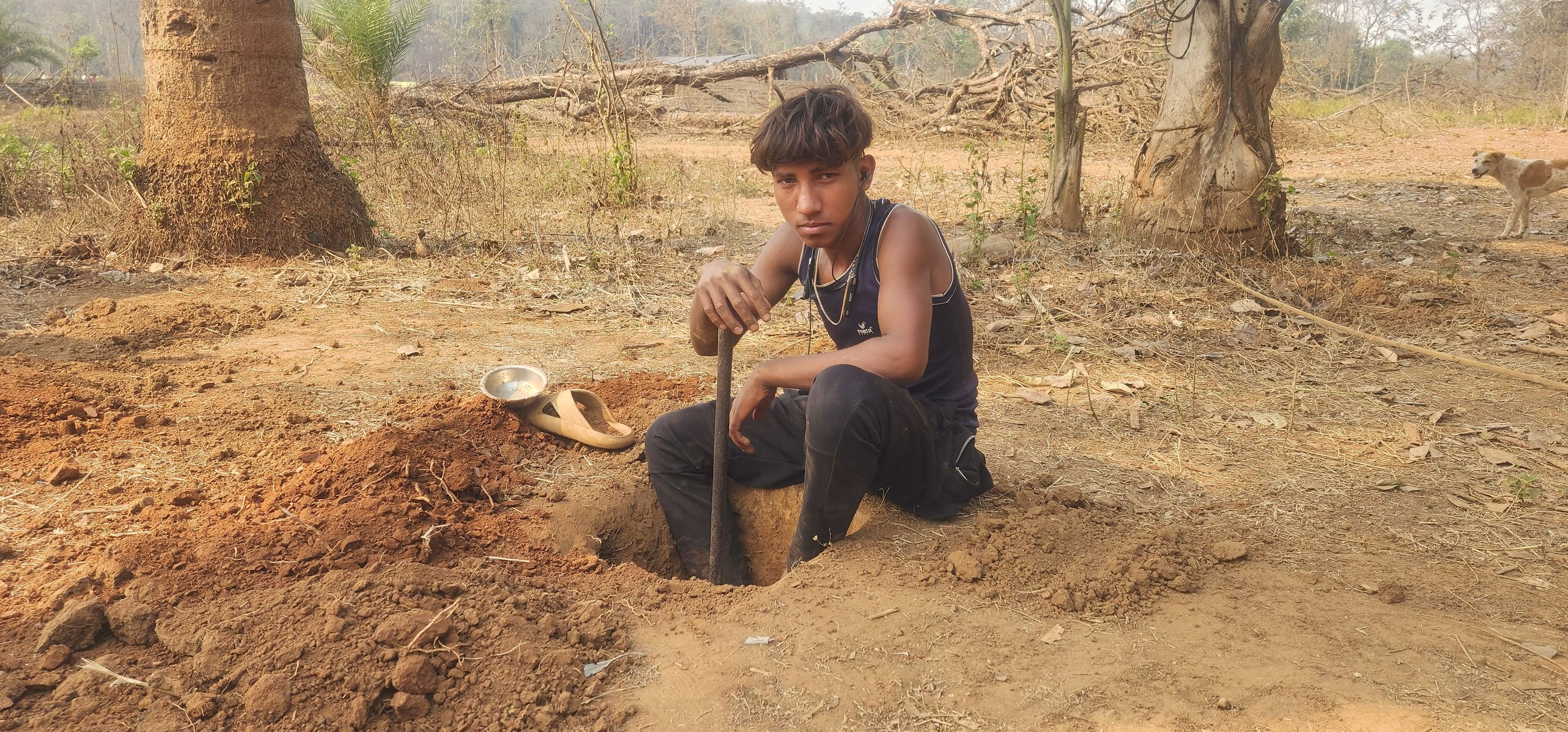 Sundarlal Wadde, 14, preparing ground for his grocery store in Baleveda village, Abhujhmad Hills, Chhattisgarh.