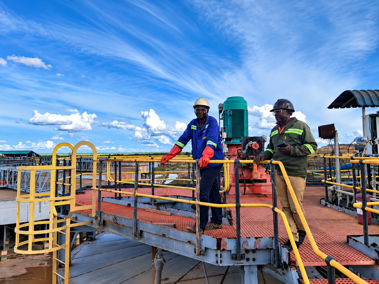 Workers in protective gear at an industrial processing unit. Photo: Elisha Iragi