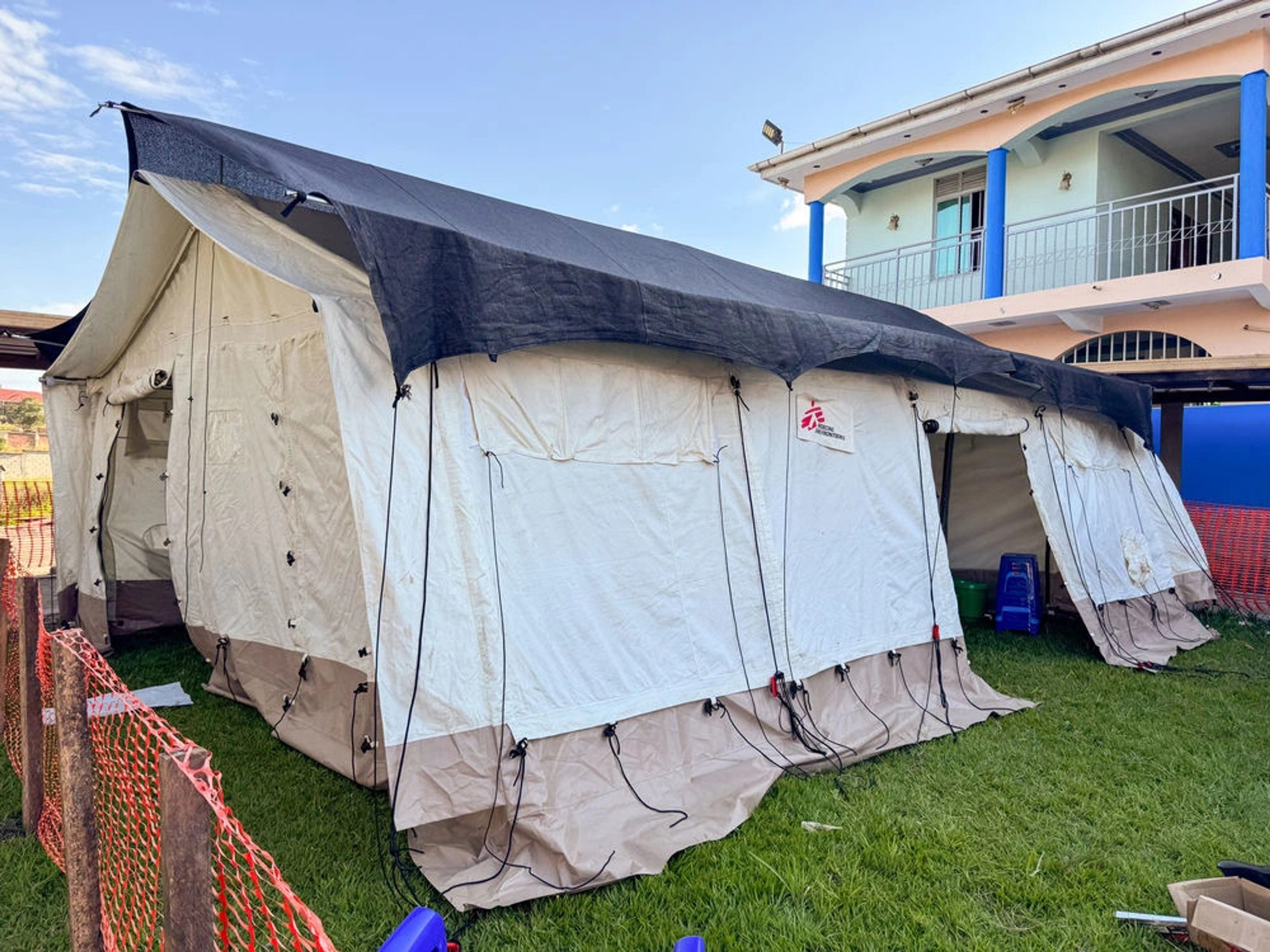 Temporary tents within Ebola Treatment Centre compound store medical equipment while teams work to scale up the response. The structure is a part of the expanding facilities to support patient care, infection prevention and control measures. Credit: Anna Scönhoefr/MSF