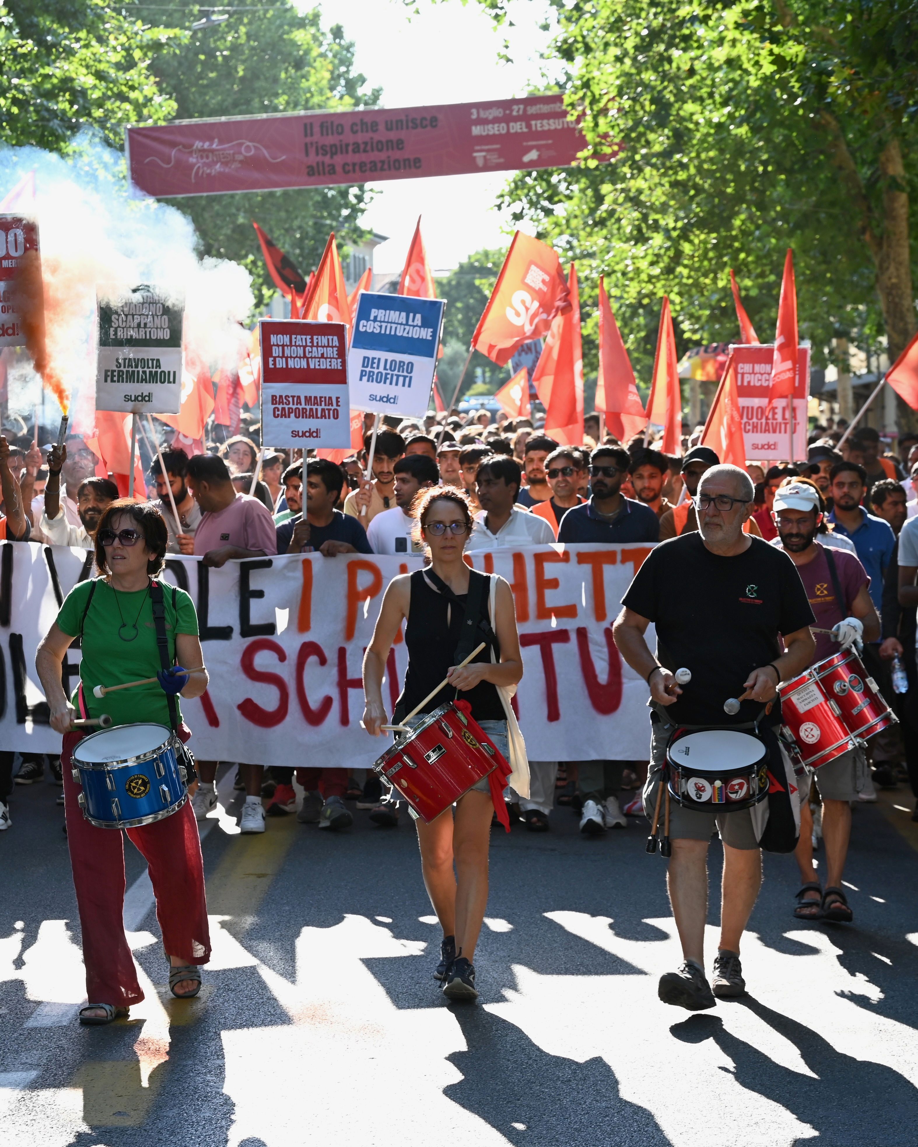 The slogan “Those who oppose pickets support slavery” is carried during a march of around 1,500 people in solidarity with workers involved in the ACCA labour dispute in Prato, Italy, on July 6, 2026. Photo: Special Arrangement/Sudd Cobas