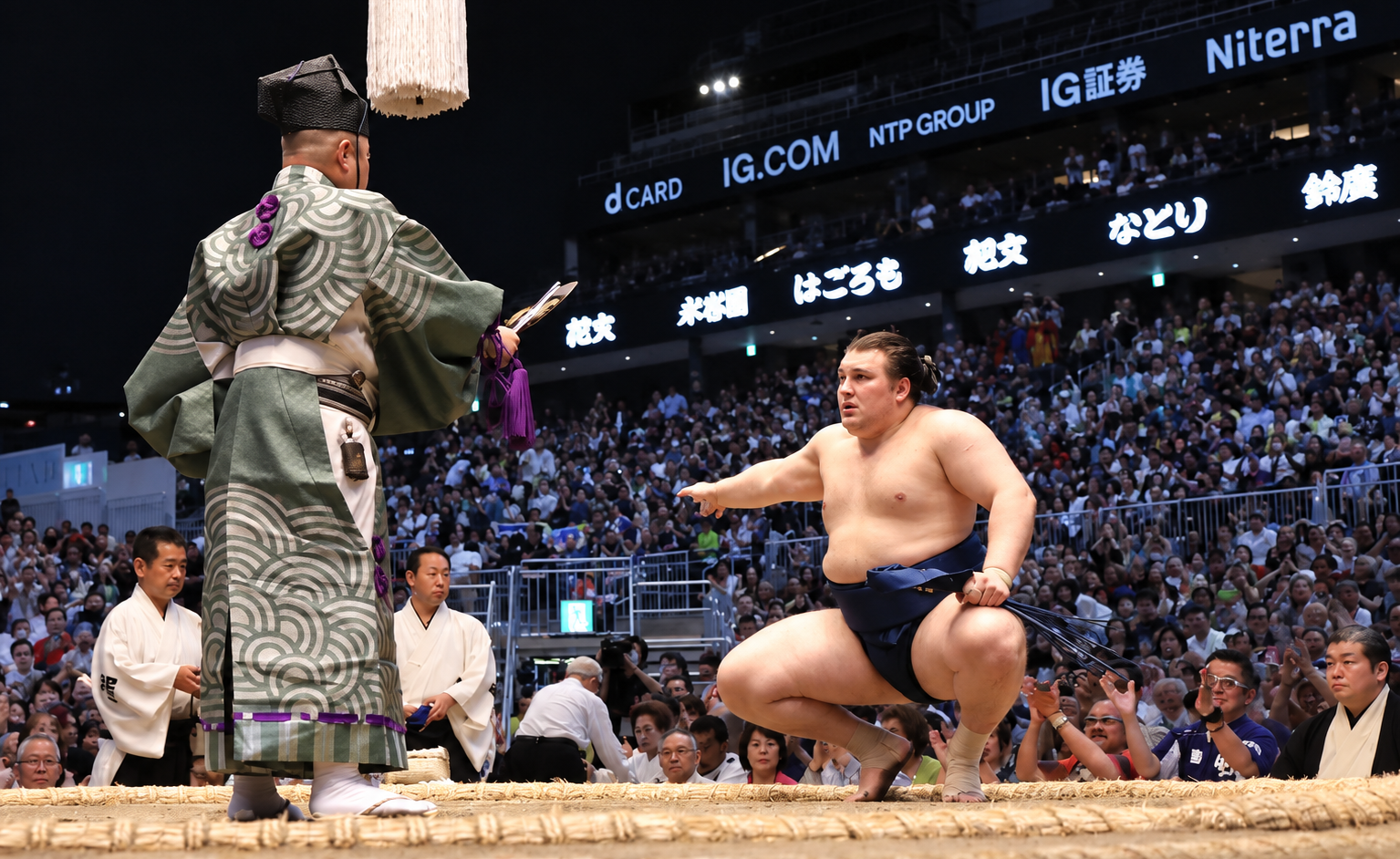 Ukraine-born Aonishiki Arata crouches in the dohyo (ring) facing the gyoji (referee) during the Nagoya Grand Sumo Tournament at the IG Arena in Nagoya, Japan, on July 26. Photo: X / Japan Sumo Association.