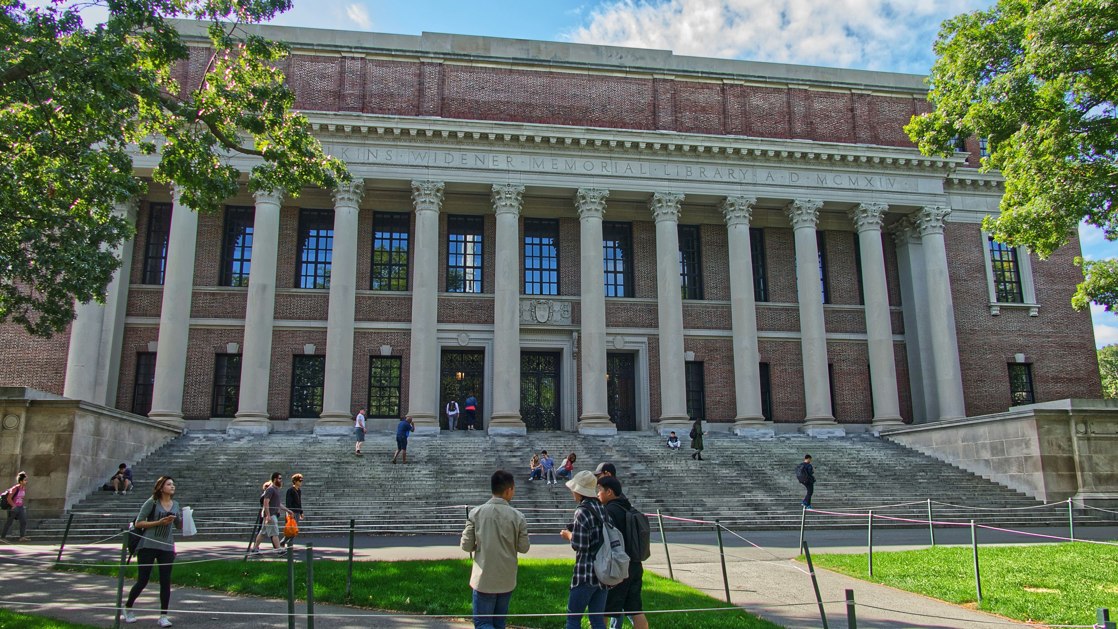 People standing in front of The Harry Elkins Widener Library. Photo: Pascal Bernardon/Unsplash