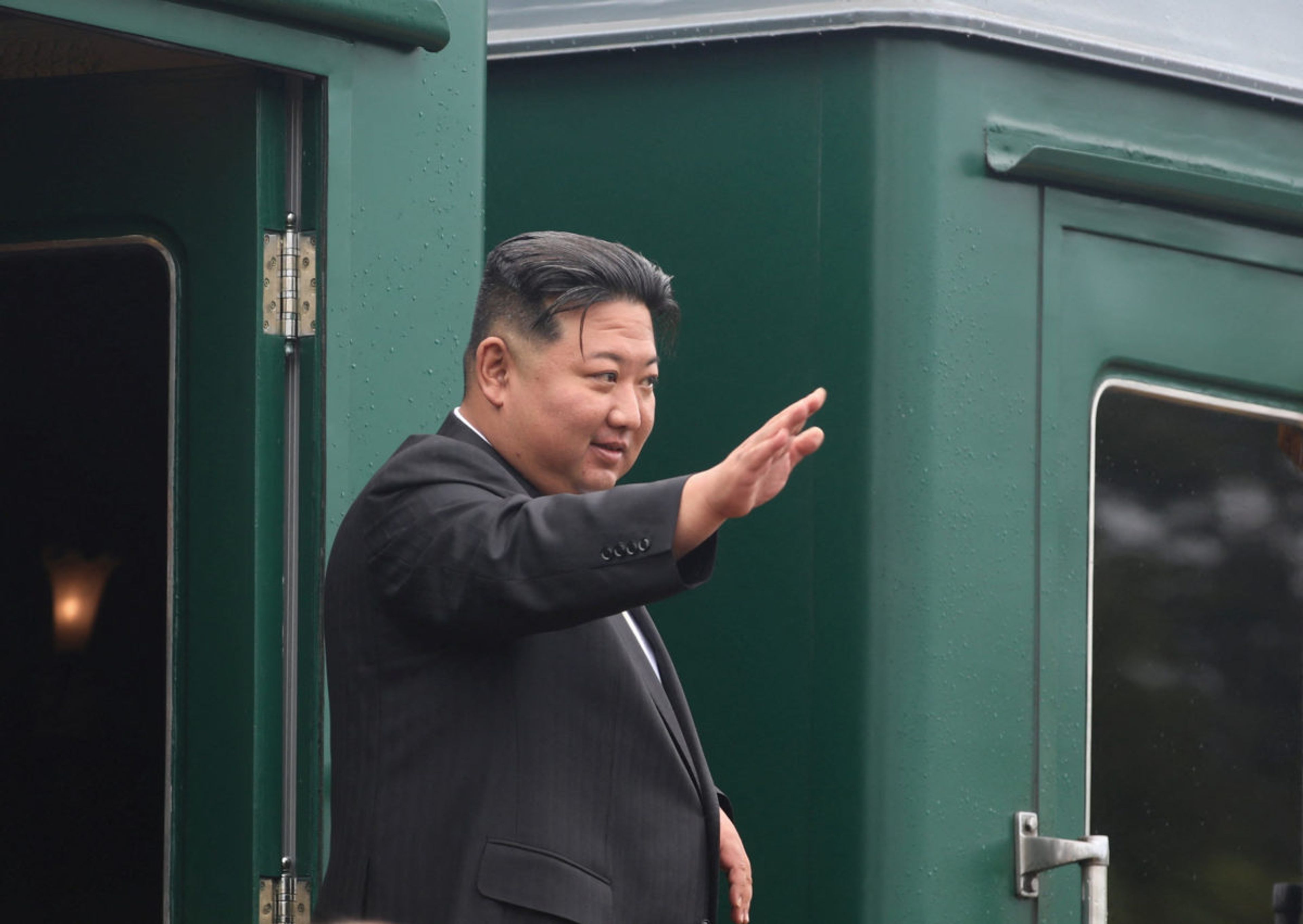 North Korean leader Kim Jong Un waves as he boards his train at a railway station in Artyom, near Vladivostok, Russia, on September 17, 2023.