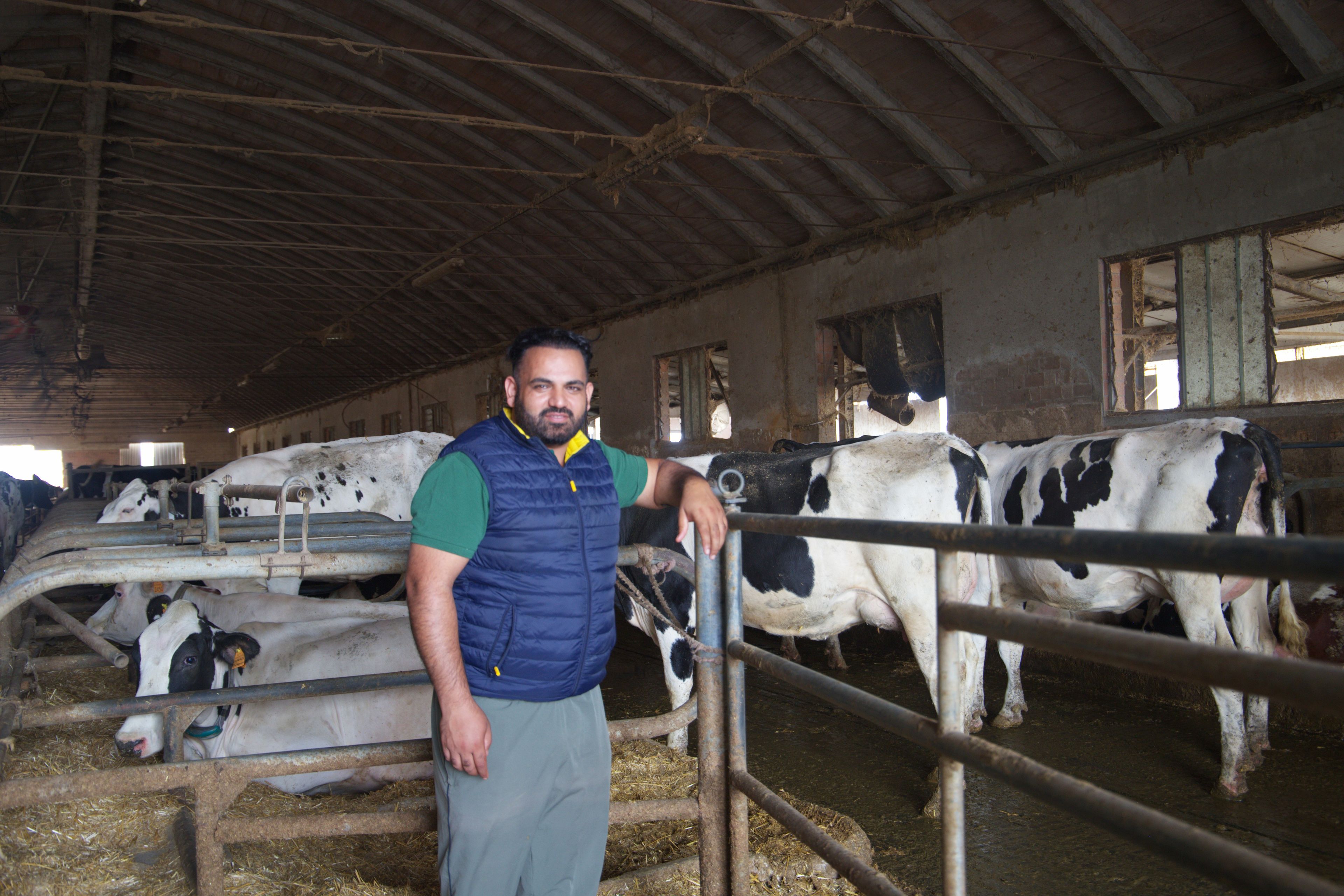 Chatha Amandeep, 36, outside one of his farms. He arrived in Italy in 2004 to join his father and began working in cattle sheds at just 14. Today, he owns three farms with a total of 629 head of cattle. Photo: Monica Pelliccia