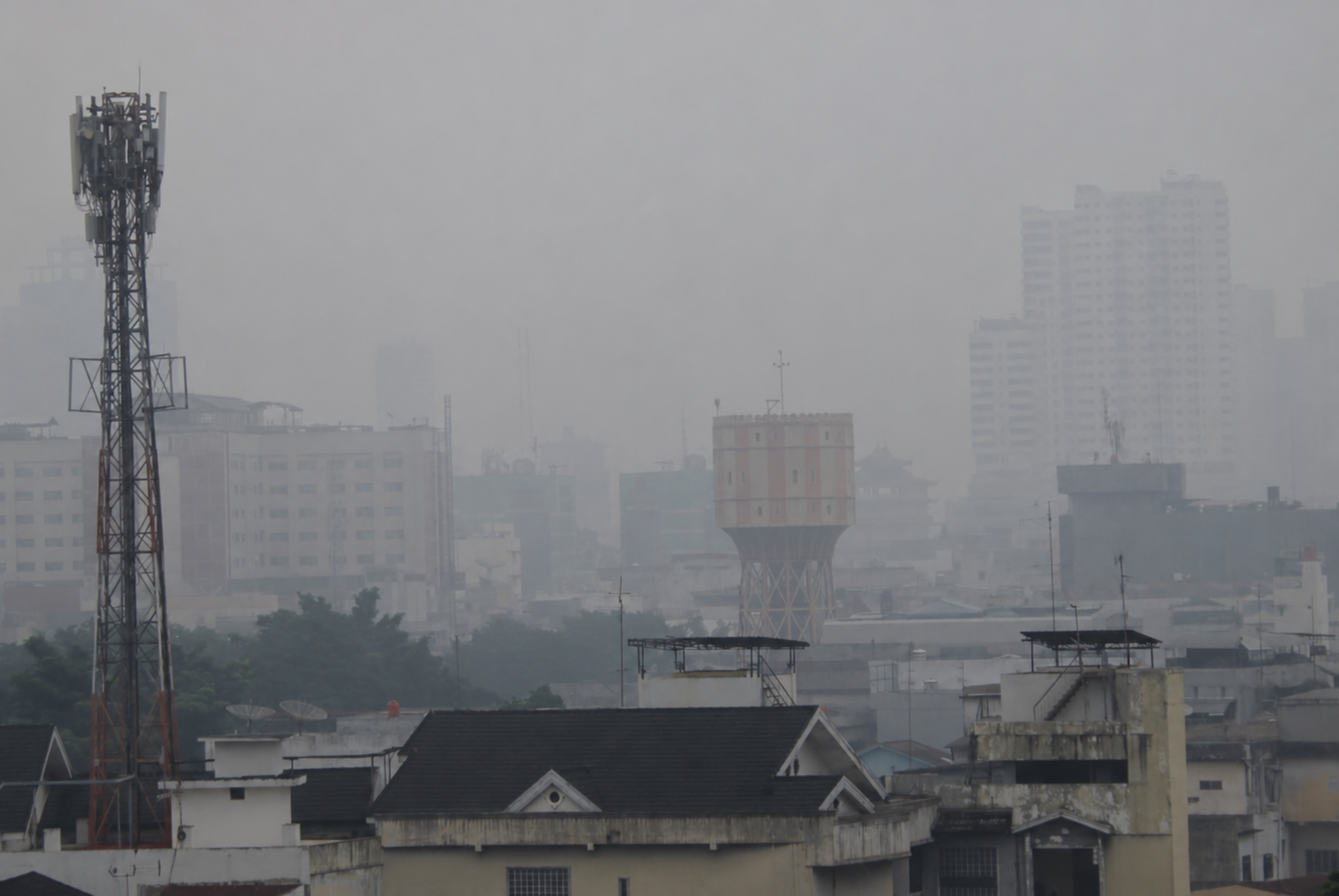 The iconic Medan City Water Utility (PDAM Tirta) building is shrouded in smoke from forest and land fires in several Indonesian provinces on October 14. Photo: Ahmidal Yauzar