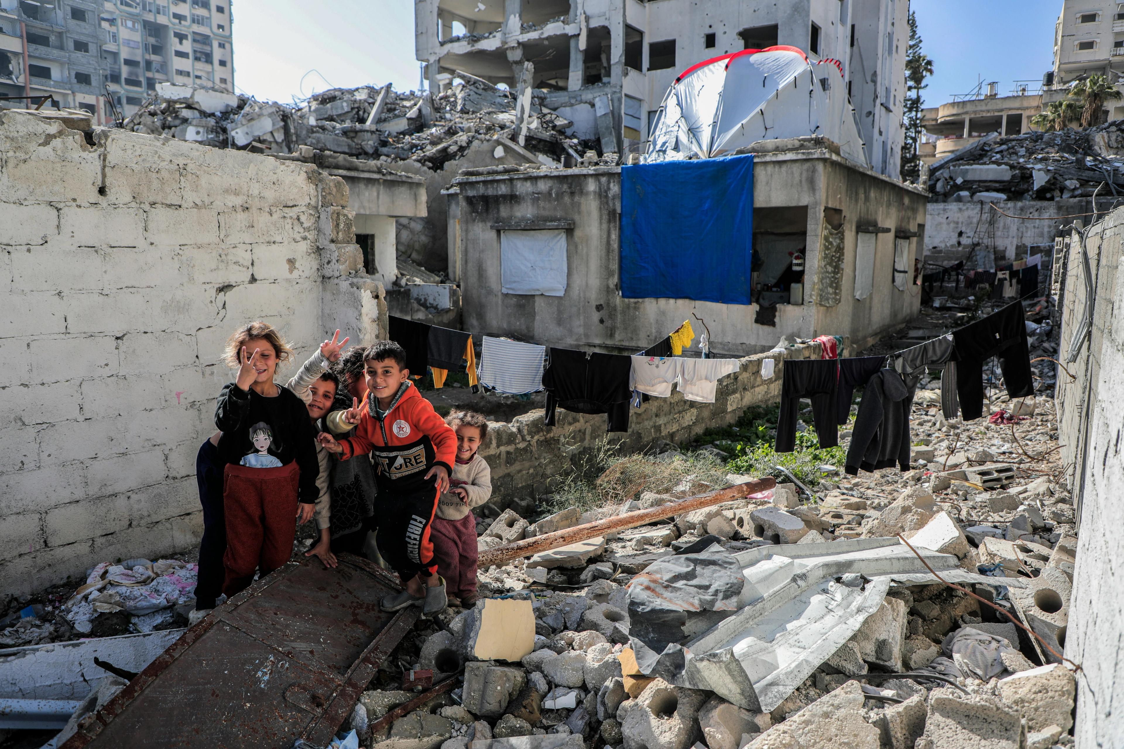 Gaza— Palestine Children among the rubble of their house