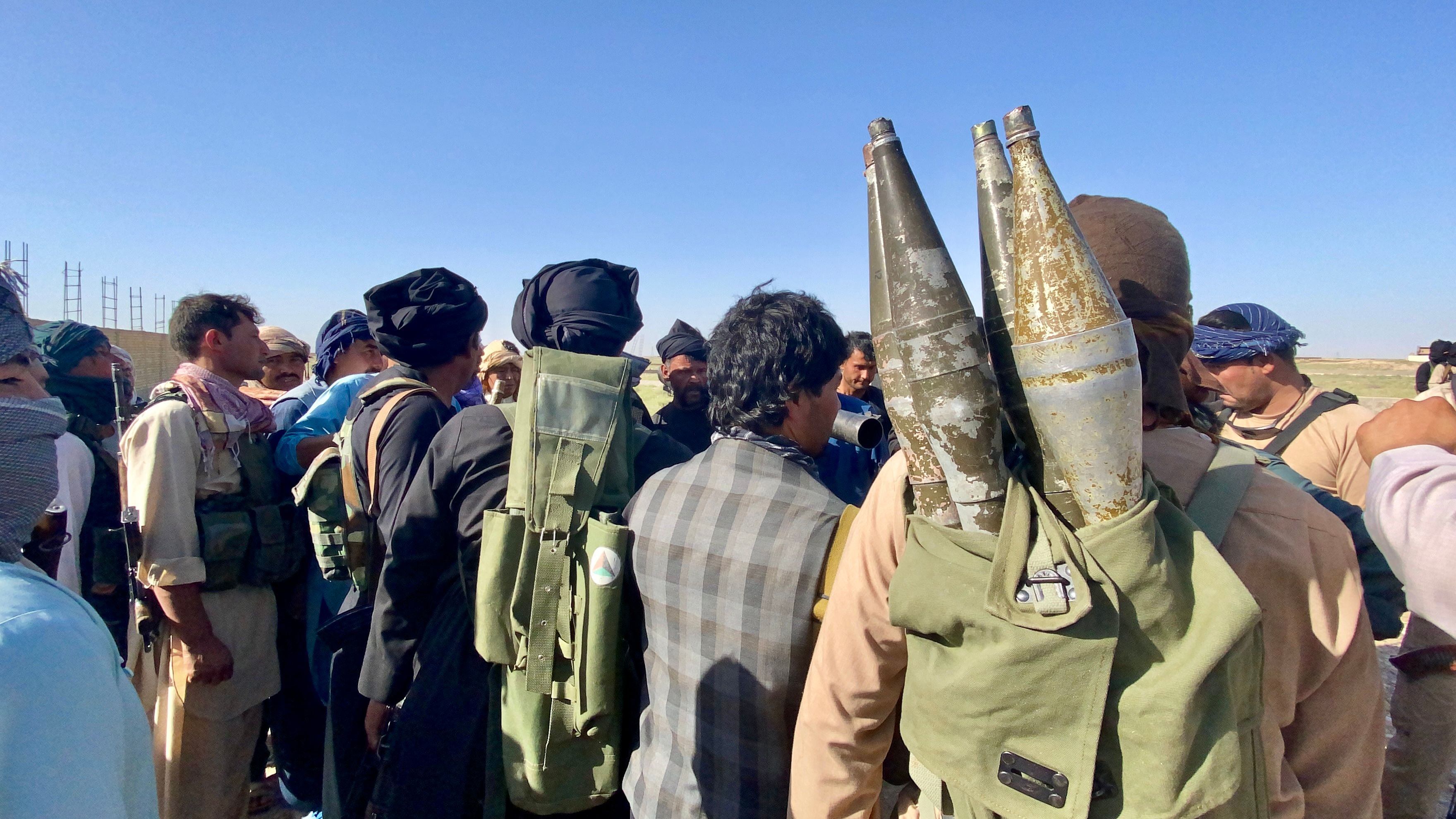 Former Fatemiyoun Brigade fighters aligned with pro-government forces receive instructions from a senior commander in Mazar-e-Sharif, Balkh Province, in July 2021.