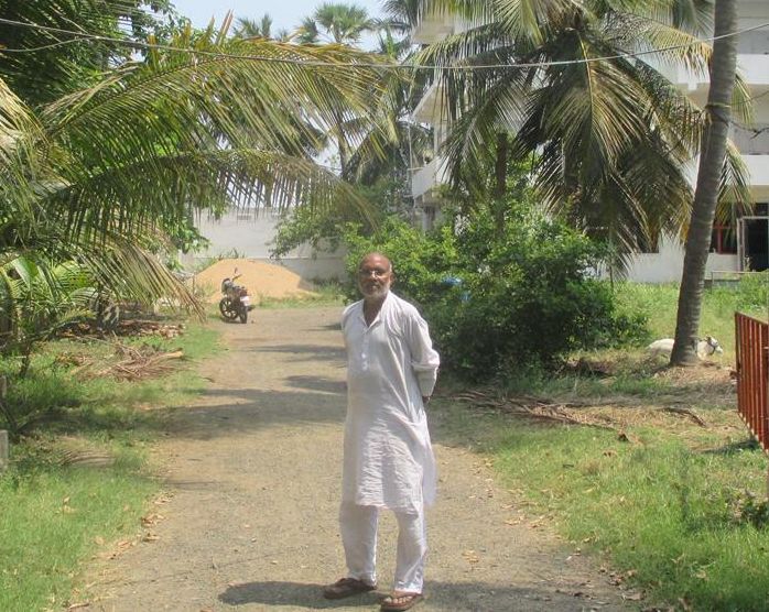 Subba Rao, founder of Ideal School in Jinnuru, Andhra Pradesh standing inside the sprawling campus.