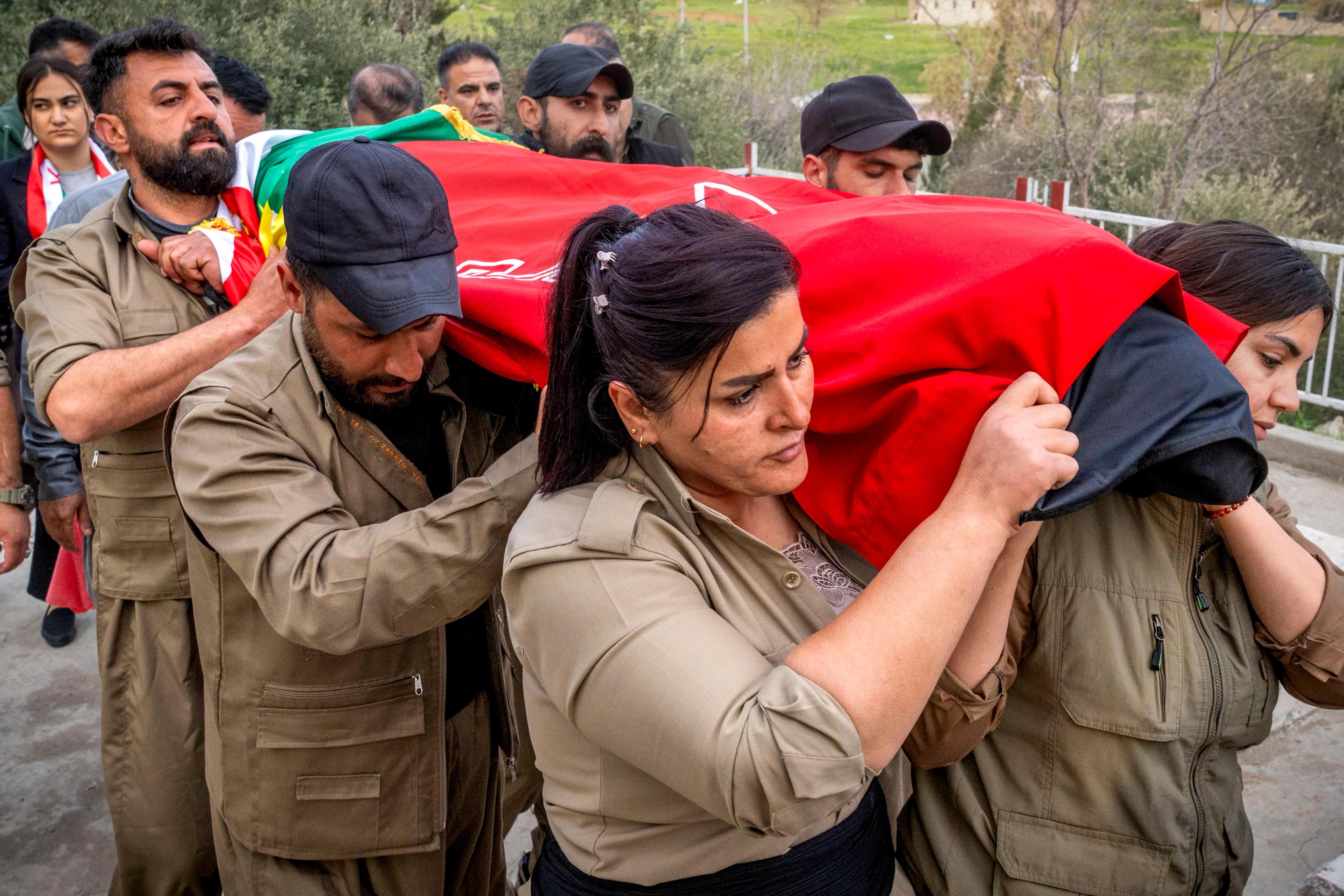  Fellow Komala soldiers carry the body of Ghazal Molan, 19, to her burial site in Sulaymaniyah, Iraq. 
