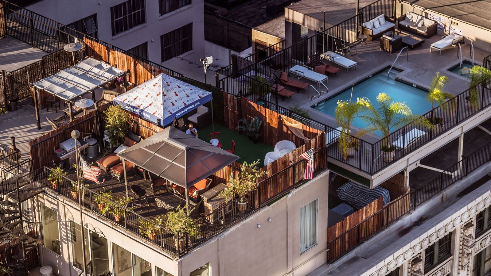 Students relaxing on a rooftop terrace near a Los Angeles campus apartment