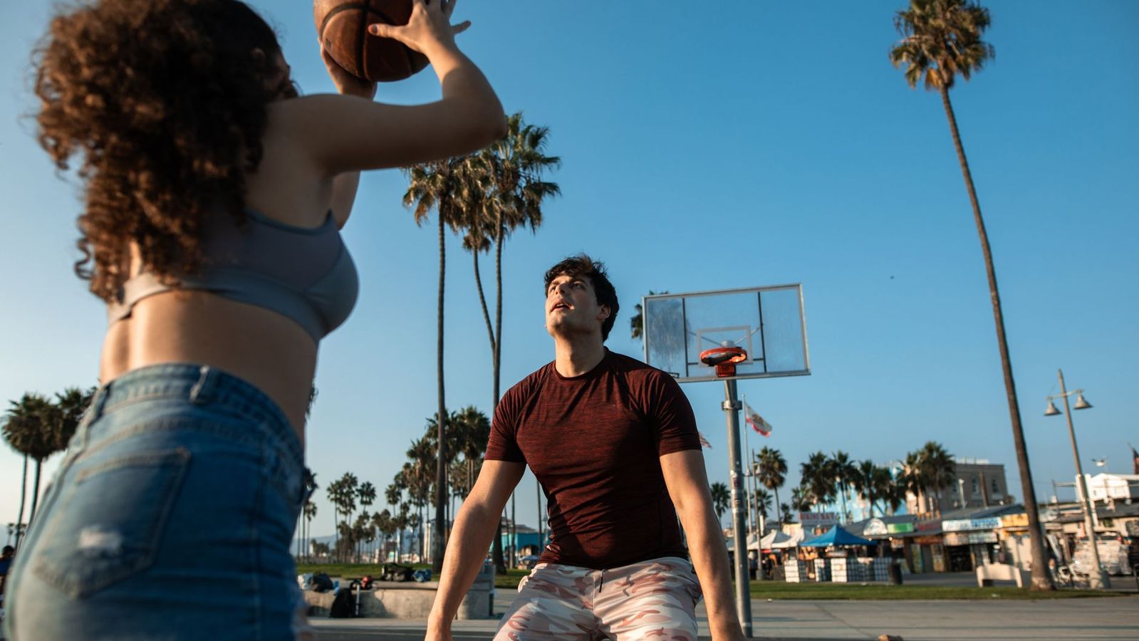 College students using a modern apartment fitness center near a Los Angeles campus
