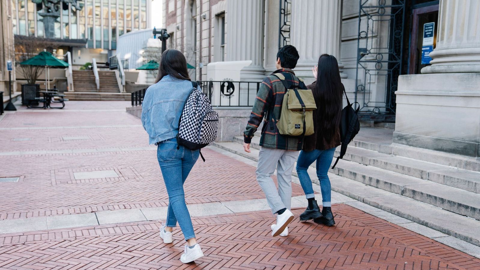 College students approaching a secured apartment entrance near a Los Angeles campus