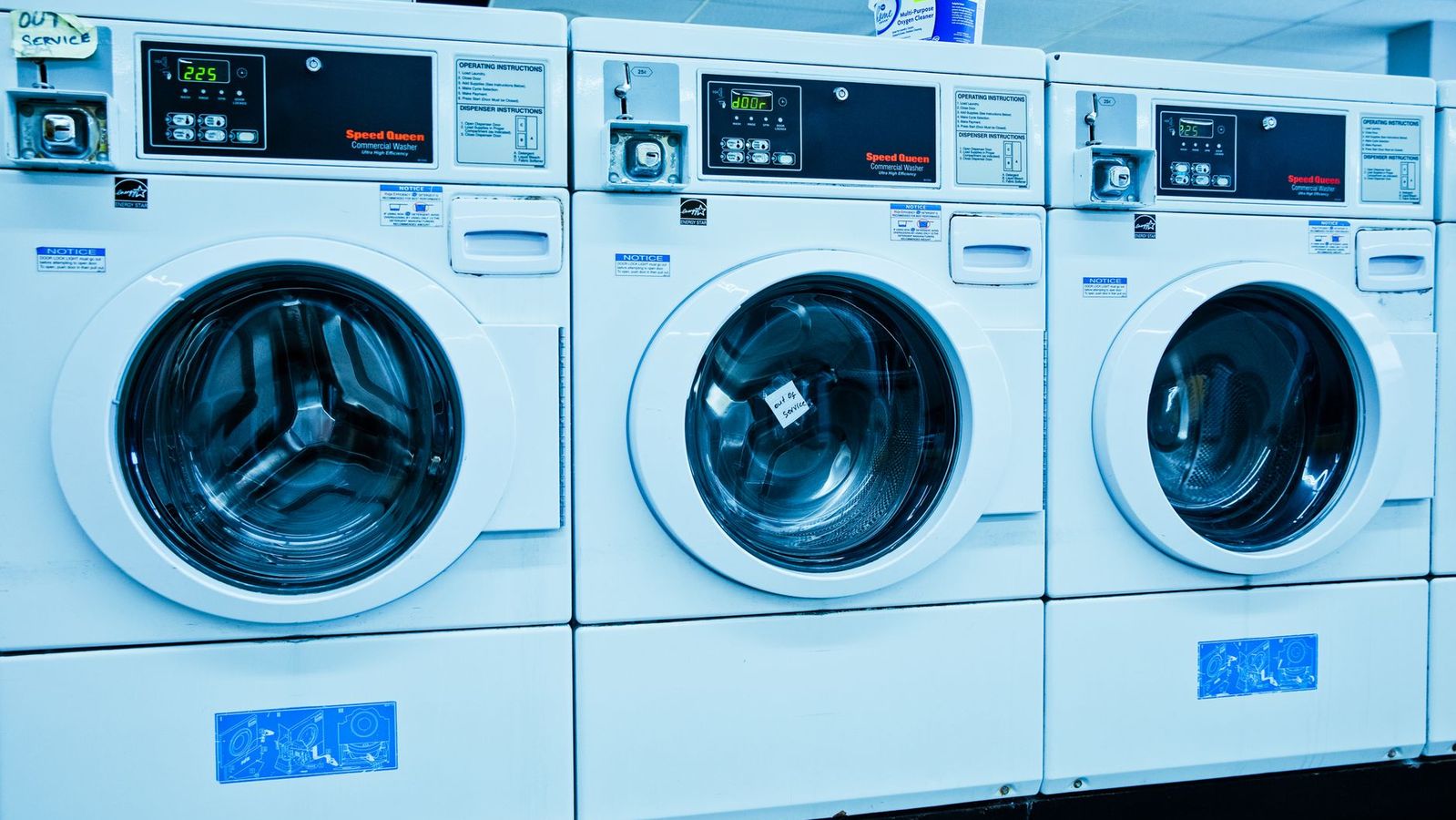 Rows of washing machines representing laundry-equipped apartments near UCLA