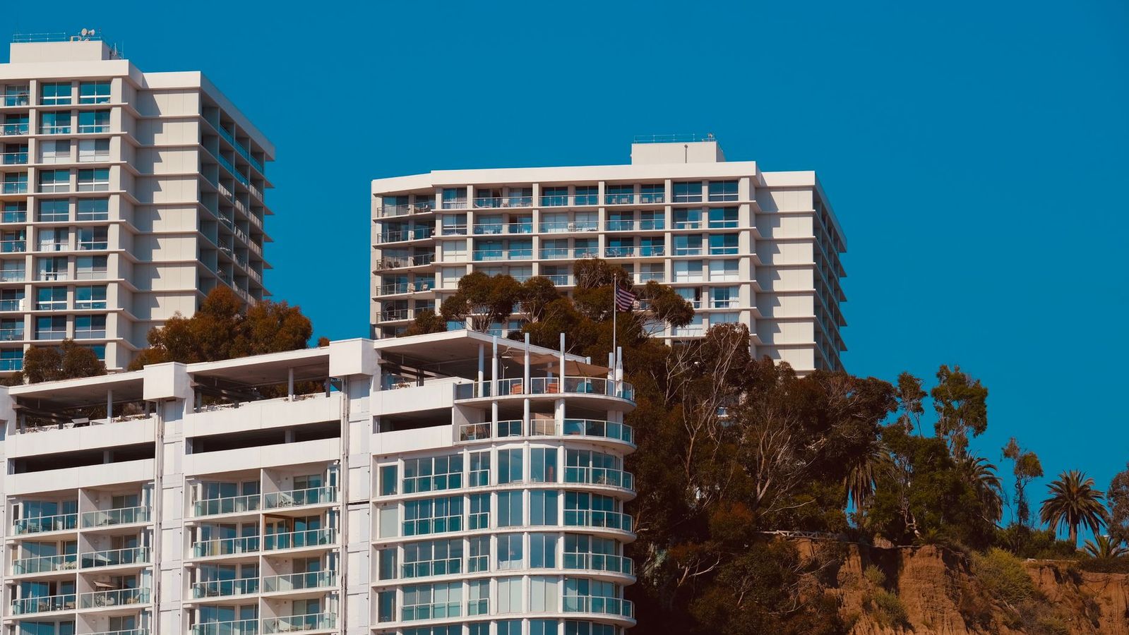 Students at a sunny apartment pool near Santa Monica College housing