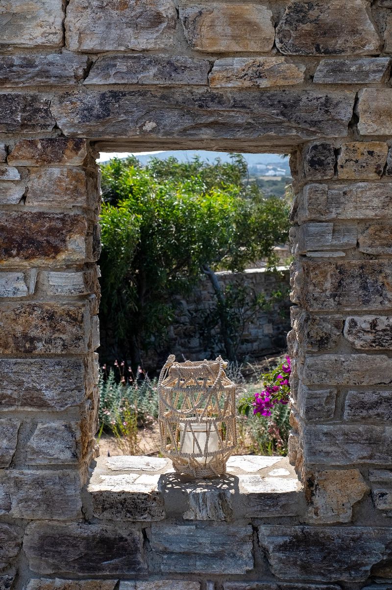 A lamp in the garden, in-between a stone border