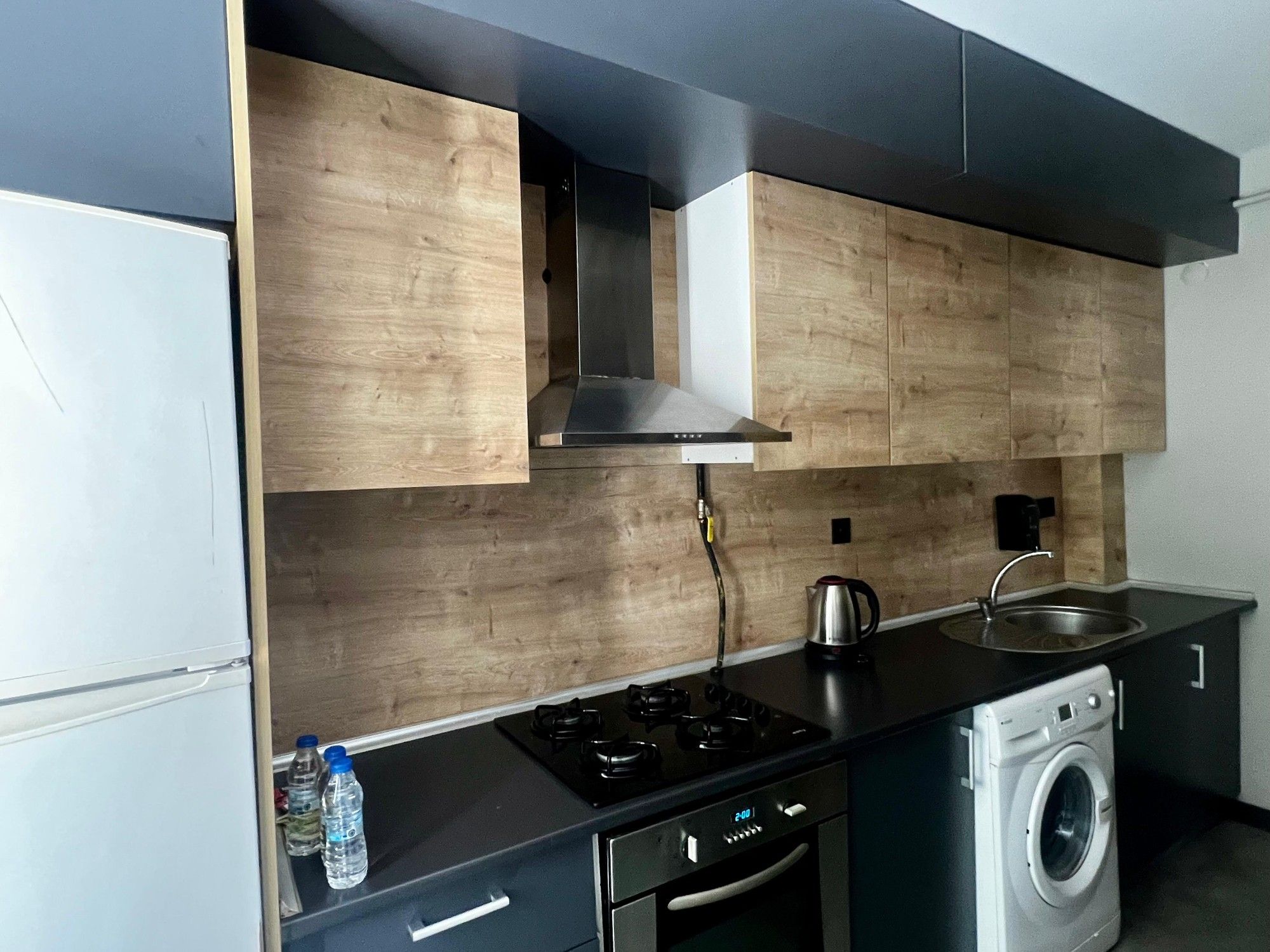 CITYLOFT 36 Two Bedroom Suite: Ocak, fırın ve çamaşır makineli mutfak