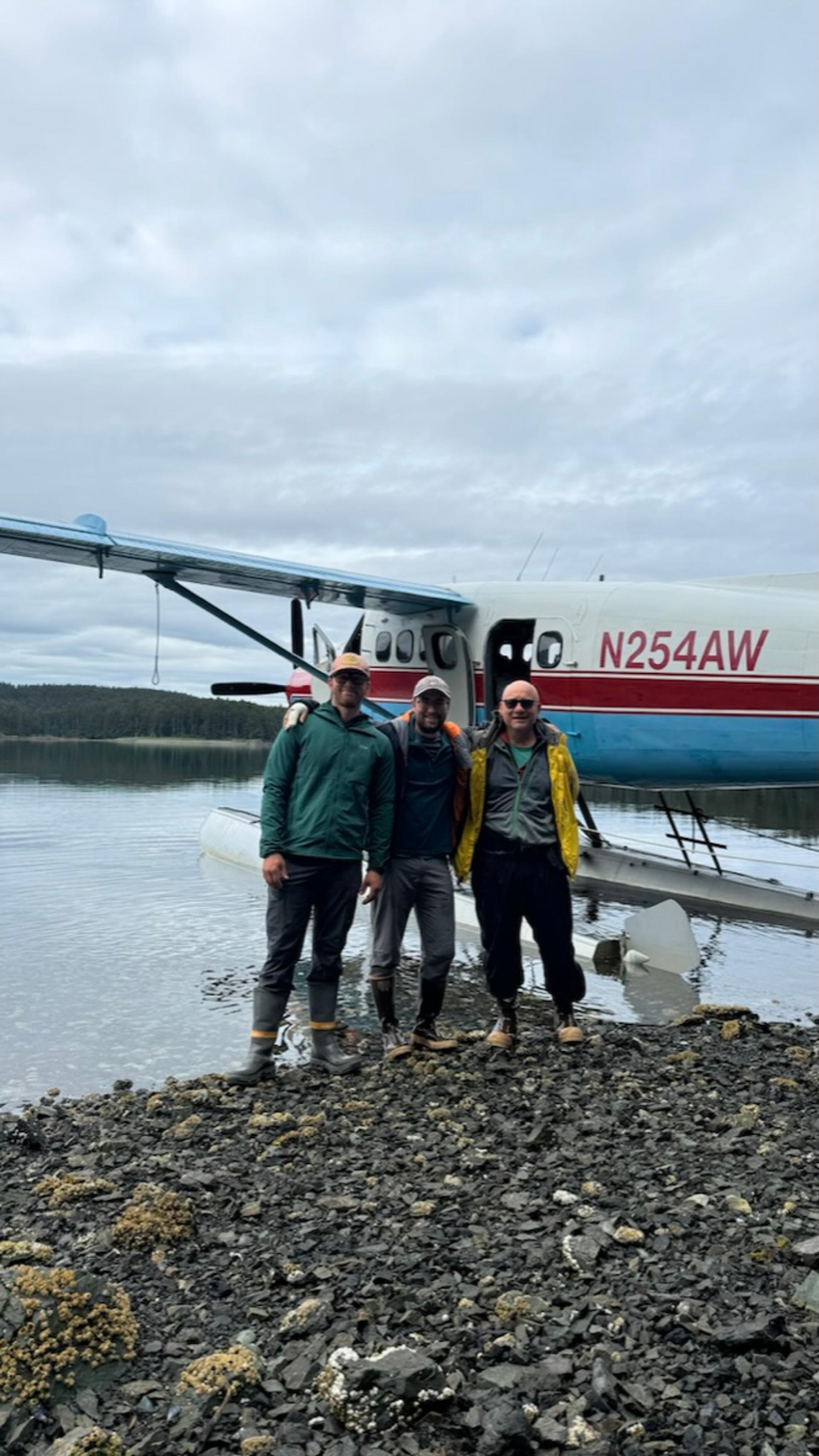 Researcher Brandon Keough and his team during a field expedition in a remote coastal or lake region.