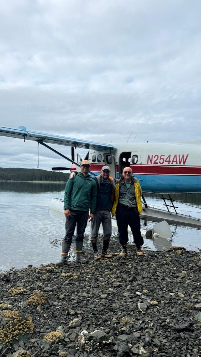 Researcher Brandon Keough and his team during a field expedition in a remote coastal or lake region.