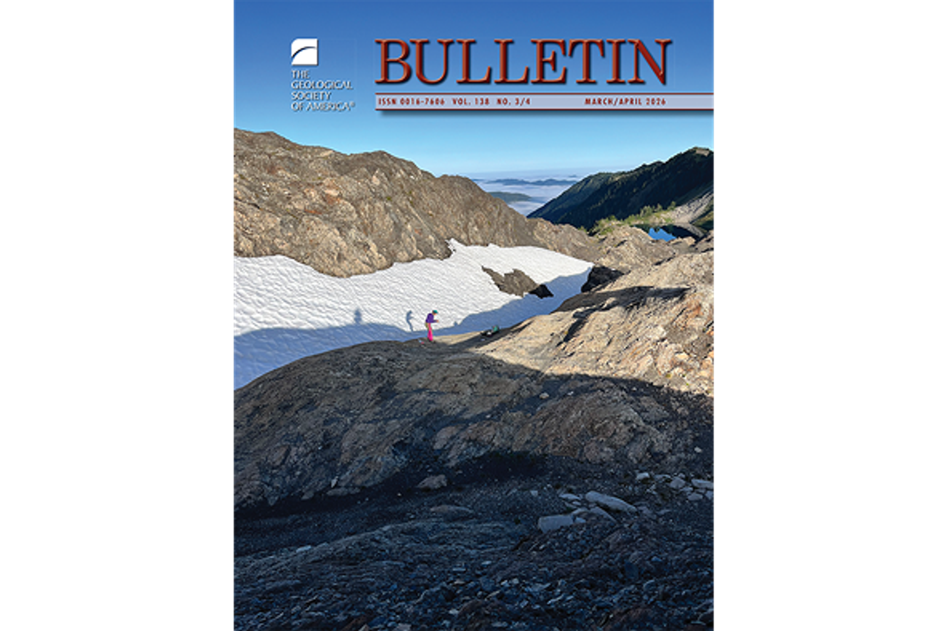 The cover of the March/April issue of the journal GSA Bulletin. The cover photo depicts a woman standing on a rock outcrop with a camera. More rock, snow, and distant peaks under a cloudless blue sky are in the background.