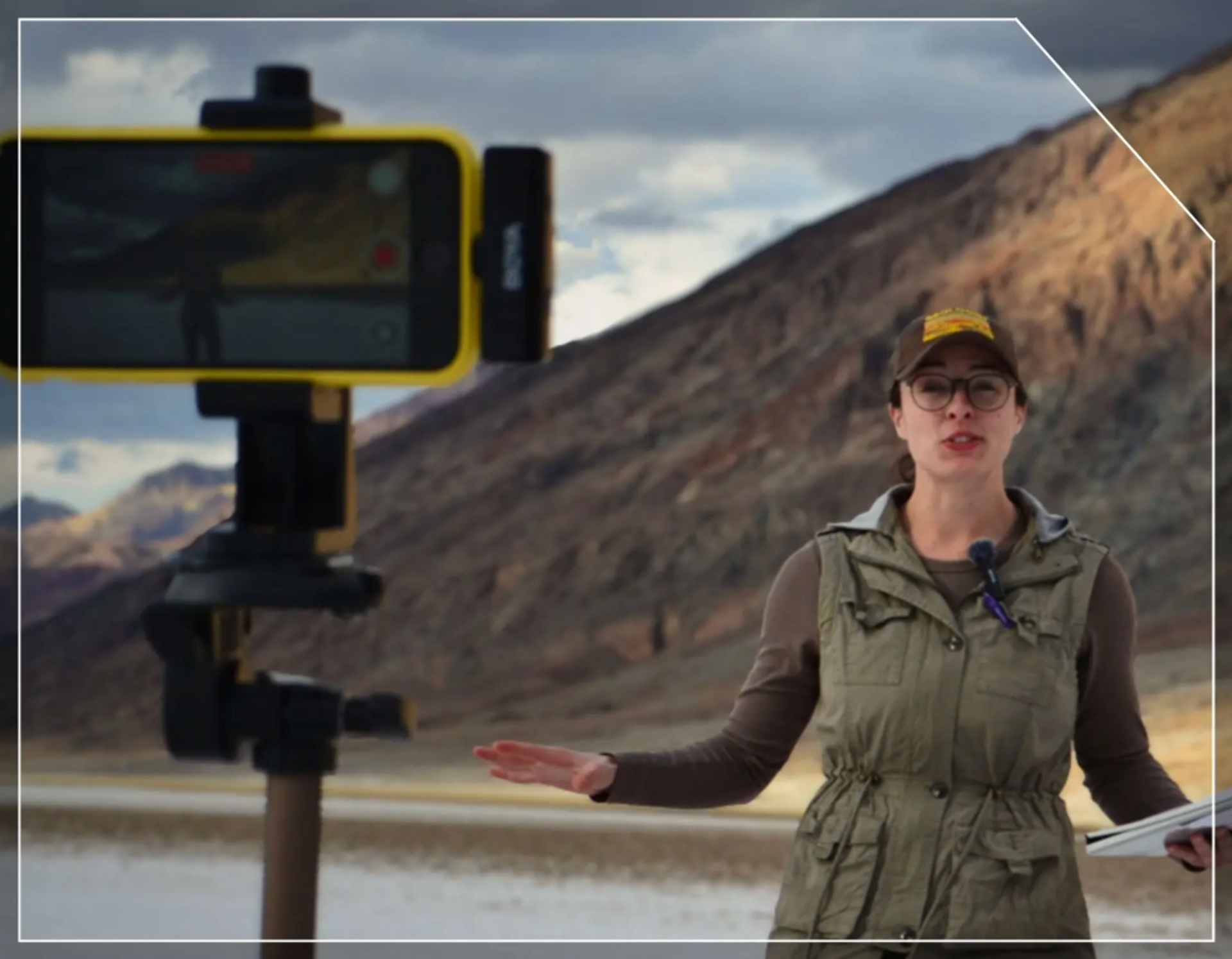 Image of Rachel speaking in front of an iphone stand.