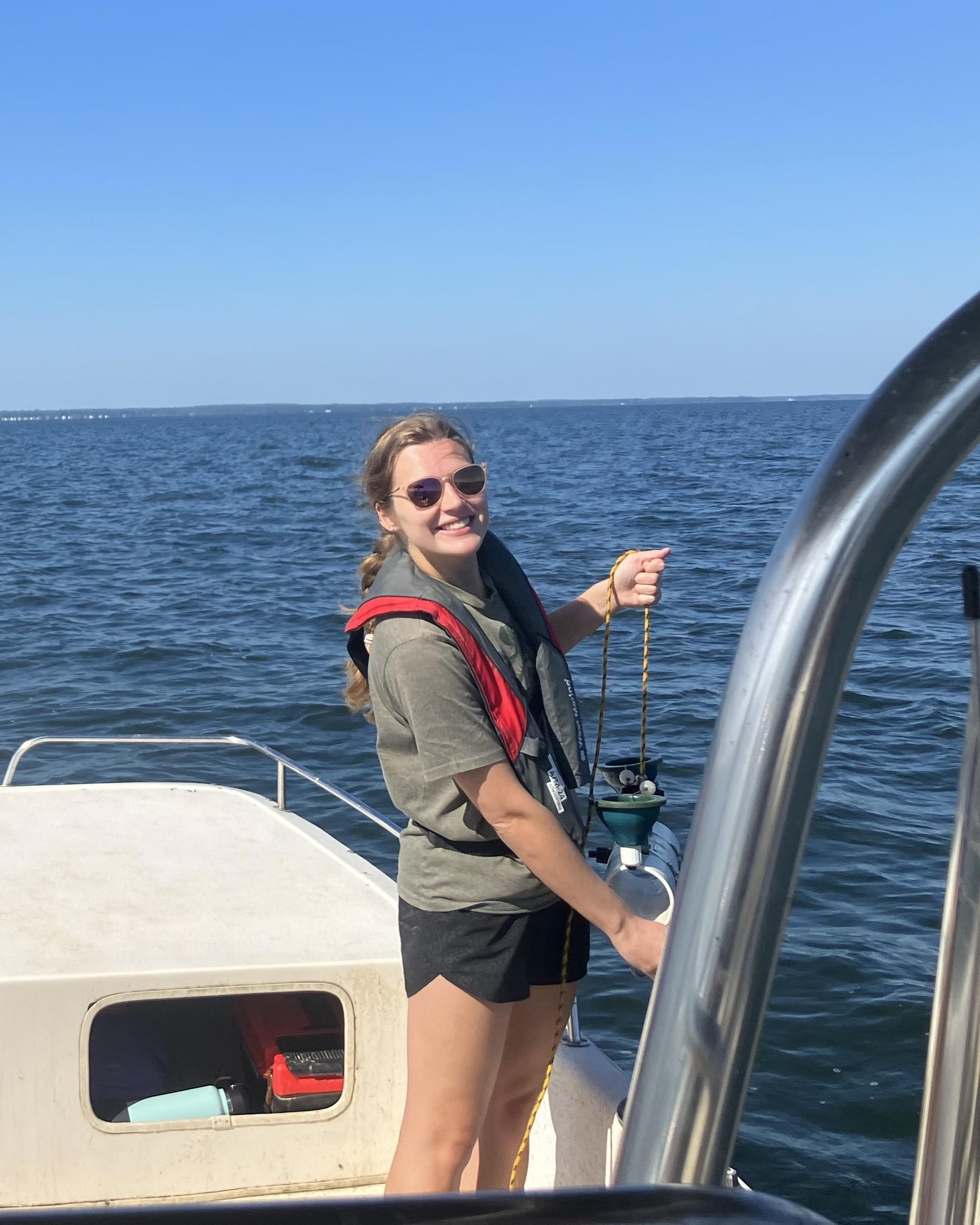 Photo of GSA Graduate Student Research Grant Recipient conducting fieldwork on boat