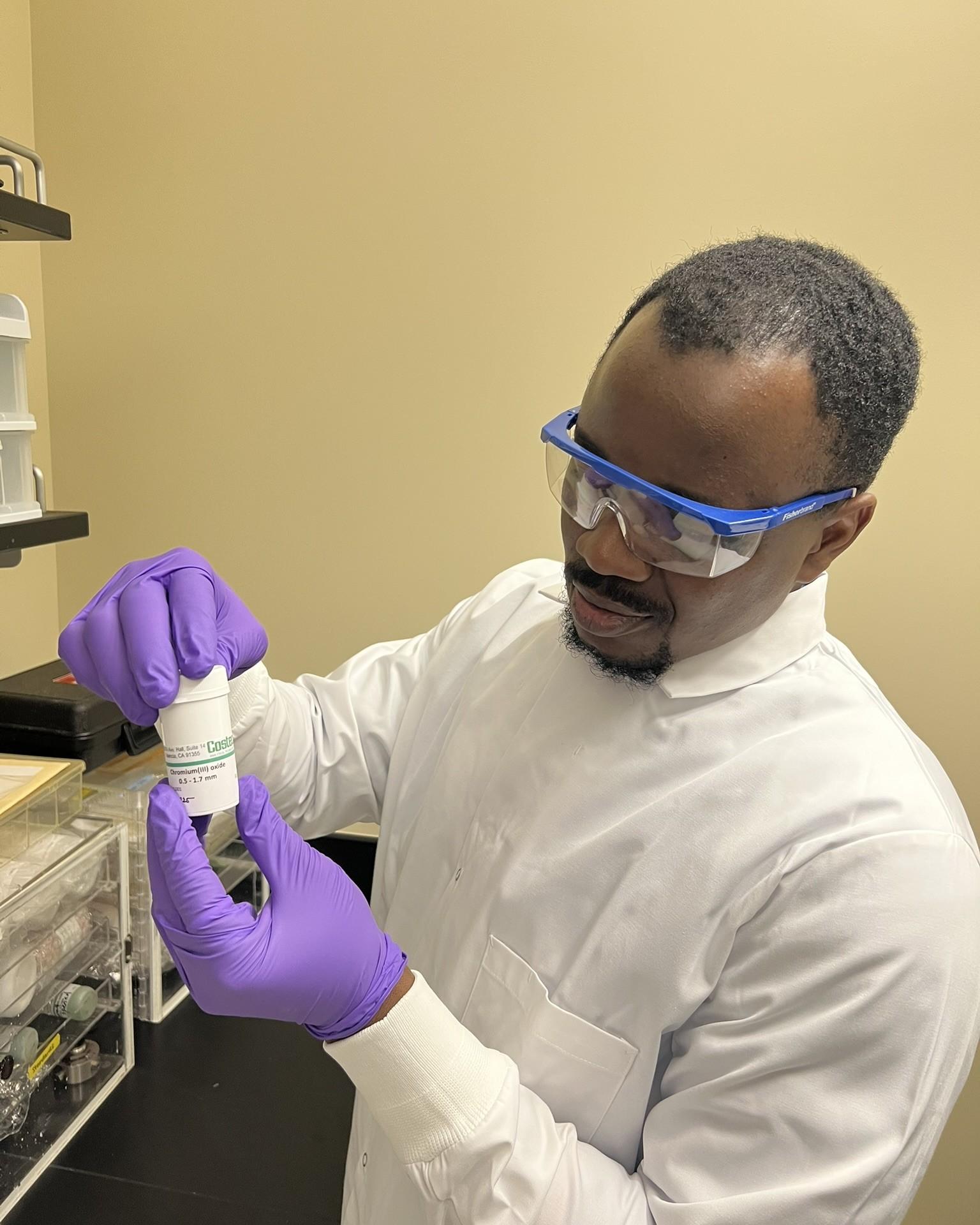 Photo of GSA Graduate Student Research Grant Recipient conducting labwork